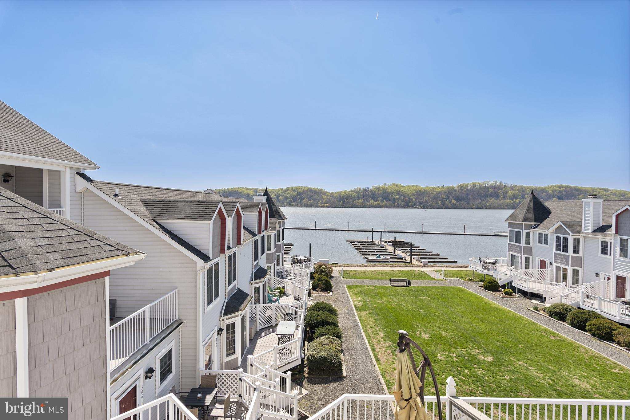 TURNKEY-WATERFRONT-GARAGE-POOL & CLUBHOUSE! Less than an hour's drive to Philly or Baltimore Airports. Tomes Landing in Port Deposit is an ideal weekend or full-time waterfront residence. This lovely two-bedroom, two-and a half-bath unit with two waterfront decks has been beautifully maintained and updated by the current owner with a remodeled kitchen with birch cabinets, granite countertops, and stainless-steel appliances. Top-of-the-line engineered hardwood flooring is used throughout the kitchen and family room. The primary bedroom is spacious with a total primary bath remodel. The deck off the family room has gorgeous water views of the Susquehanna River. The community pool is right on the water, and the one-car garage with 1/2 car space of storage room leaves ample room for a car plus all the fun toys. Join the golf cart movement in Port Deposit and head down the block to join all your new friends at the local restaurants or grab your paddleboards and head out to the river! For boaters, there is a marina for slip rentals and nearby high and dry storage, or you can use the public boat ramp. Walk down the riverfront promenade to Lee's Landing and walk one block over to multiple restaurants/bars, and boutiques. This home is conveniently located within minutes of Hollywood Casino and Great Wolf Lodge. I-95, Route 1, Route 40, and the MARC train are quick commutes. The possibilities for fun are endless! Condo dues cover essential services, including water/sewer, exterior building maintenance, common grounds and area maintenance, snow and trash removal, flood insurance, and Pool/Clubhouse.