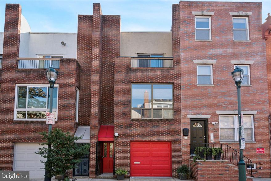 Welcome to this (not a cookie-cutter) contemporary '90's townhome with GARAGE parking on a tree-lined street in convenient Graduate Hospital.  First floor features  powder room, updated kitchen, dining room with glass wall exit to stunning 25' rear garden.  Second floor offers den with gas fireplace, bedroom #1/den and full bath.  Third level has bedroom #2 with slider to deck with spectacular city view, 3rd bedroom, full bath and laundry.  Hardwood floors.  Floating stairs.  Greenfield Elementary catchment. Close to HUP, CHOP, shopping, public transportation, eateries, Rittenhouse Square.