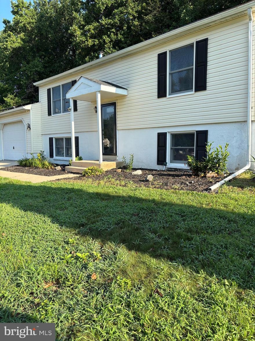 MAKE OFFER IF THIS IS THE AREA YOU LIKE. AVAILABLE IMMEDIATELY.  This home has SOLAR the total payment to Delmarva from July 2024 to May 2025 was $ 212.73. The payment to the Solar Company for the purchase of the system is  $ 77.55 a month for a total electric for one year was $ 1143.33. Copies of actual bills on request.  Total square feet 1554. Enjoy the Spring in your own back yard, lounge on the deck and watch nature around you. Birds in the trees and squirrel scamping around.  Firepit area for the family to enjoy or sit under the gazbo. Room for a garden or sports area for all to play.  Rainy days can be enjoyed in the kitchen making your favorite yummy desserts.
Kitchen open to living room so you can glaze at the tv while baking. Lower level is currently a Master bedroom and 4th bedroom. Large bath. with twin wash bowls. Large untility area with washer and dryer connection.  Two car garage and off street parking.  Close to I 95, Route 40 and easy drive to Philadelphia and Baltimore and easy drive to the ocean beaches. Owners are in the process of moving and doing some repairs.  Solar can be transferred  seller pays $ 80.00 per month.  Electric bills are very low. HOUSE IS AVAILABLE IMMEDIATELY.