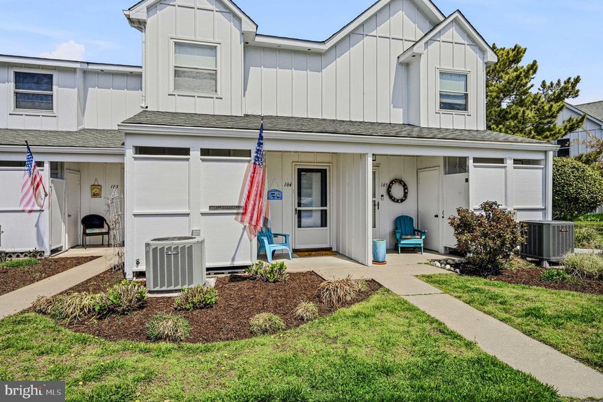 Welcome to your beach retreat in the beautiful community of Mallard Lakes!  This 2-bedroom, 1.5-bath home offers beautiful lake views, abundant wildlife, and the relaxed rhythm of coastal living.
As you approach, you're greeted by a recently updated outdoor shower—perfect for rinsing off after a day at the beach—along with a convenient storage closet to keep beach gear, tools, and essentials neatly organized. Step inside to a bright, welcoming kitchen featuring extra lighting, a TV, and a bar area—an ideal spot to gather, sit, and chat with the cook. Just beyond, the space opens into a combined dining and living area designed for easy entertaining and everyday comfort. The living room is anchored by a wood-burning fireplace, framed by beautiful white custom-built-ins that provide both character and functional storage, creating a warm and inviting focal point year-round.  An enclosed porch extends the living space and showcases serene lake views—perfect for morning coffee while watching birds and local wildlife or unwinding in the evening surrounded by peaceful natural scenery. Just outside, a paver patio with a retractable awning offers another inviting space to relax and take in the view.  Upstairs, you’ll find two well-sized bedrooms along with a full bathroom that is both functional and spacious, offering comfort for both everyday living and guests. Thoughtful updates have been completed, including new flooring and carpet, fresh paint, updated lighting, washer and dryer, upgraded patio doors, and an updated outdoor shower—making this home truly ready for whatever you need - whether you're looking for a weekend escape, investment opportunity, or full-time residence.  Mallard Lakes residents enjoy a range of amenities, including pools, tennis, pickleball, basketball and volleyball courts, a hot tub, playgrounds—all within a well-maintained community just minutes from Fenwick Island and Ocean City, stores and restaurants.  Be sure to watch the video and make an appointment today!