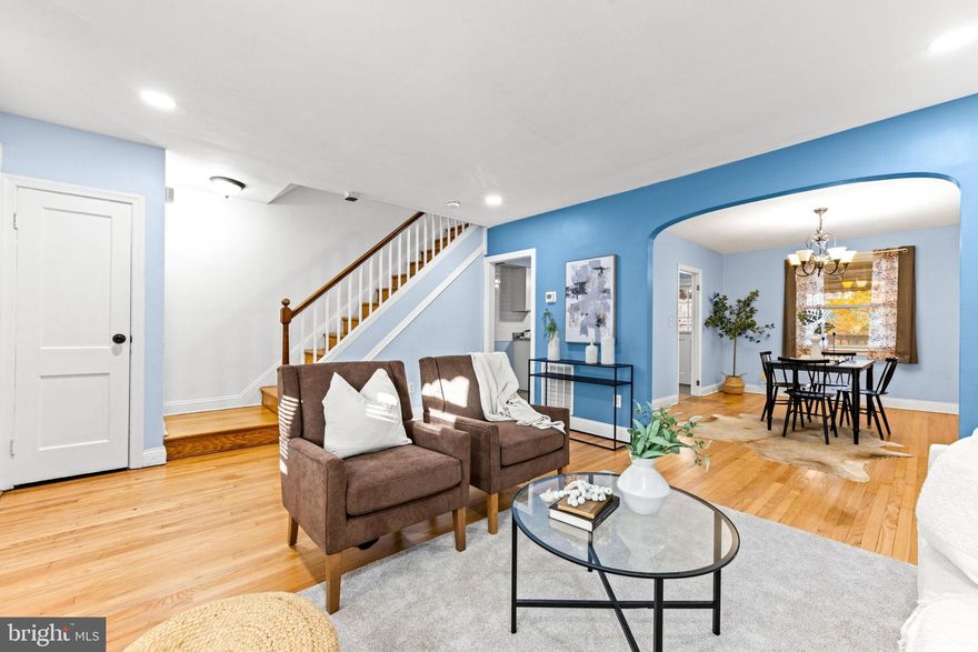 Beautifully updated townhome offers three finished levels of comfortable living space. The main level features a spacious living room, separate dining room, and a bright, renovated galley kitchen filled with natural light. The kitchen opens to a covered rear deck overlooking a convenient 2-car parking pad. Upstairs includes three bedrooms and a full bath. The large primary bedroom offers new carpet, generous closet space, and plenty of room for a king-size bed. The partially finished walk-out basement provides a newly added second full bath, laundry area, and a flex room—ideal for a 4th bedroom, home office, gym, or storage. Conveniently located near Lake Montebello, downtown Baltimore, parks, and major commuter routes—this move-in ready home combines modern updates with a great location!