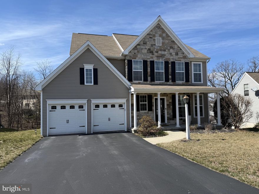Come home to 135 Ava Drive located in Red Lion, PA. This one owner home is move in ready and waiting for you to call it home!  Enjoy sitting on the front porch with your morning coffee, or an evening cup of tea featuring stone accents. Entering the home is a spacious foyer with a large and open dining and living space. The kitchen is truly the heart of this home, open and spacious with loads of natural light! The kitchen is open to the family room, and sunroom with plenty of casual dining space. The kitchen offers a large island with double sink, upgraded countertops, backsplash, all stainless-steel appliances included, featuring a large fridge, gas cooktop, wall oven, dishwasher and microwave. Off the kitchen is a bright sunroom with hardwood flooring. The family room offers a gas burning fireplace.  The laundry is on the main level.  Upstairs you will find the spacious primary suite with walk in closet and private tiled bath featuring double vanity, soaking tub and glass shower. There are three other nicely sized bedrooms upstairs along with second full bathroom. Head to the finished lower level with more natural light offering a walk out basement, with windows. The basement offers a large flex space, an additional bathroom and the fifth bedroom. This home is located in a quiet country setting, in a neighborhood but is close to all shopping, dining spots, and major highways. Easy to access Maryland and Lancaster County.  Come see today while it lasts!