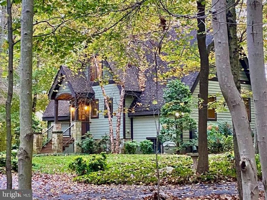 RENTAL AVAILABLE JULY 1.  Serenely situated on 4.79+/- acres of protected and nature-filled land with mature trees, this remarkable modern home offers a tranquil retreat. Featuring an open-concept floor plan with an abundance of natural light through beautiful oversized windows, soaring cathedral ceilings, and custom wood flooring. The state-of-the-art chef’s kitchen is anchored by a large center island with a breakfast bar and a second sink, and features stainless steel appliances, granite countertops, and sliding glass doors to the peaceful back deck. The kitchen overlooks the dining room with built-ins, which flows seamlessly into the sun-drenched great room with its two-story vaulted ceilings and a handsome stone fireplace. A spacious screened-in porch with wood-paneled, vaulted ceilings adds to the many entertaining spaces with idyllic backdrops. Two first-floor bedrooms, one full bath, and laundry complete the main level of the home. Upstairs, the gracious owner’s suite with an en suite full bath and high ceilings, as well as a fourth bedroom and full bathroom can be found. The walk-out, expansive lower level provides even more entertainment options with a recreation room complete with a wet bar and drink fridge. There are two sets of sliding glass doors to the back patio with a fountain, a hot tub, and an outdoor shower, all overlooking the verdant setting.  Additional offerings include a blacktop / sport court, as well as energy-efficient geothermal heating and air conditioning.  22919 Wildcat Road delivers privacy and tranquility surrounded by mature trees and lush greenery, yet it is conveniently located close to major transportation routes, including I-270 and I-495, and local restaurants and parks. Landlord to arrange for two yard clean-ups per year (spring and fall)!