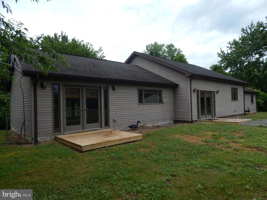 TWO HOUSES FOR THE PRICE OF ONE!!   Priced for a quick sale!   2BR/2B 2236 sq. ft. home built in 2006 on .538 acres.    Main Section is an open Living Room/Dining Room/Kitchen.  One wing is the owners suite with spacious bedroom area plus sitting room area.  Adjoining Bath is large with Jaccuzzi tub, shower.   Bedroom and Bath has tile with radiant heat.   Second wing has a Bedroom, Bath with Laundry and a sitting room, all with radiant heat. Large rear deck.   Detached 1 car garage on one half and workshop on the other side.   Additional 621 sq. ft. home built 1948.  Used as a rental. All three structures are on separate parcels.  Garage had new roof and siding in 2020 and Rental had a new roof in 2020.   In addition to the heat pump in the newer home,  an outdoor wood burning stove heats the newer home plus the rental home.