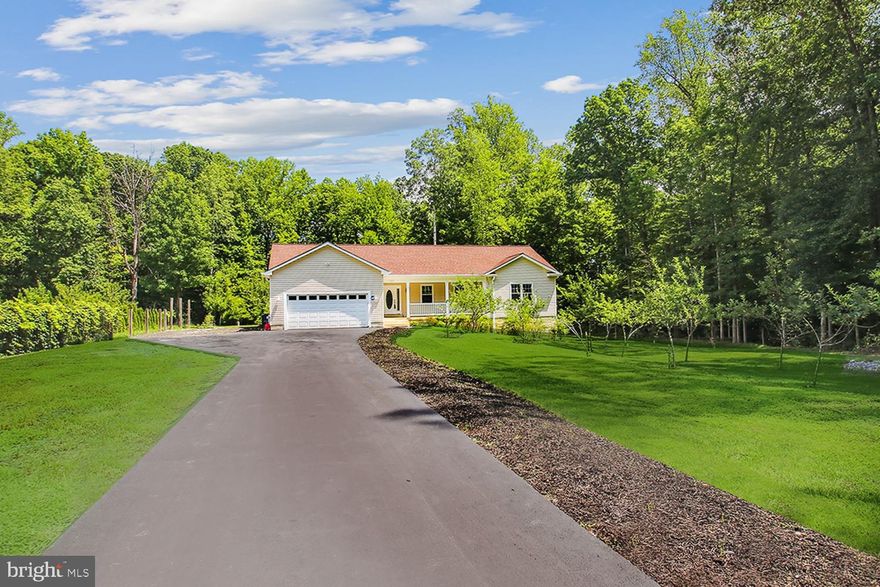 EXPAND and BREATHE in this WINSOME RANCHER NESTLED ON 2 WOODED ACRES yet JUST MINUTES from ANNAPOLIS/DC/BALTIMORE METRO AMENITIES! Bask in the glorious seasons from your plantation-style porch to the tree-enclosed picnic patio and yard beckoning pets & play!  SINGLE LEVEL LIVING w/self-sufficient lower level incl. Kitchenette, Bedroom/BA, Laundry, & walk-out to patio/ separate entrance (TOTAL: 3050 sq. ft.).  Possible in-law apartment!  Masterful detailing incl. decorator neutral paint palette/carpet, expert trim/moldings/chair rail, recessed lighting, & designer ceiling fans.  Abundant oversized windows streaming natural light!  Antiqued glass front door spilling into open concept Living Room & formal Dining Room w/sliders encouraging a potential deck build-out.  Sleek stainless & granite (new) Kitchen with dining bar island.  Main & lower level laundries!  Generous Primary BR w/luxe ensuite Bath.  ALL 3 Full Baths remodeled!  2 Additional BRs & Full Family Bath.  Ample closets & mega storage options! Long multi-vehicle driveway parking & roomy 2-car garage.  TOTALLY PRIVATE setting a mere 15 minutes from BWI Airport and 20 minutes to downtown Annapolis harbor. Close to daily catch eateries, golfing, boating/marinas, Westfield & Towne Centre Malls, AA Medical Center, & commuter RTs 97/50/3.  ENVIABLE TOWN & COUNTRY LIVING!