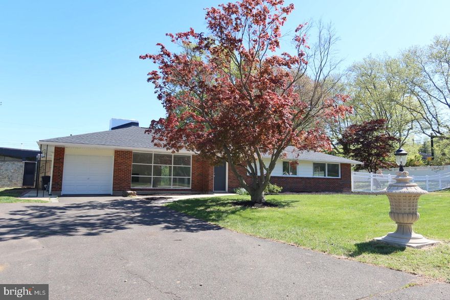 Welcome to this beautifully renovated single rancher, perfectly situated on a prime corner lot in the desirable Erdenheim area, bordering Flourtown. This inviting home offers the ease of one-floor living combined with thoughtful updates and flexible space to fit today’s lifestyle.
Step inside to a newly renovated kitchen featuring classic white shaker cabinets, sleek quartz countertops, a spacious island with seating, and a bright kitchen table area—ideal for both everyday living and entertaining. The main floor also includes the convenience of a dedicated laundry area.
The home offers four generously sized bedrooms and two full bathrooms, including a private en-suite in the main bedroom. One of the bedrooms provides versatile use and could easily serve as a second family room, home office, or playroom. A non-functional fireplace adds character to the living space.
Set on one of the largest corner lots in the neighborhood, the outdoor space offers endless possibilities—whether you envision a pool, expanded entertaining area, or simply enjoying the open yard. A rear patio provides the perfect spot for relaxing or hosting gatherings. Adding to the property’s charm, the front lawn features a unique touch of community history, with a light post said to originate from the historic Stotesbury Estate.
Additional highlights include a one-car attached garage with driveway parking for up to four additional vehicles, a brand-new roof, and an additional detached building complete with a full bathroom and abundant natural light—ideal for an in-law suite, home gym, studio, or private workspace.
Located just minutes from major roadways, including Route 309 and the Pennsylvania Turnpike, this home offers convenient access to shopping, dining, and commuting routes. Enjoy the many nearby parks, walking trails, and outdoor activities that make this area so special.
A rare opportunity to own a spacious corner property in a sought-after location—don’t miss it!