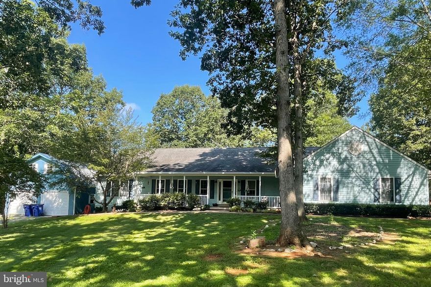 Welcome to 18299 Ragtop Road!  Brand new HVAC on inlaw side! An exceptional property with not one but 2 full homes incorporated into one home.  In-law suite is perfect for extended family or to rent out.  It has its own Living, Dining, Kitchen, Laundry, 1 or 2 bedrooms and 1.5 baths.  The apartment can be locked off from the main house for security purposes if needed.  The main home has 3 bedrooms, 2.5 baths and many, many upgrades.   Many new floors to include 2 bedrooms (carpet) and kitchen/dining area  (luxury vinyl plank.) Large rear screened porch.  Expansive rear deck.  Kitchen has granite countertops and stainless appliances.  Primary bath with granite vanity tops. Both units are complete with full basements, part of which is partially finished with a rec room, a den and a half bath.  The possibilities are unlimited with this property!  Wonderful PRIVATE pond with dock, over 13.5+ acres of amazing property!!  One, 2 car detached garage with walk up storage above and another detached one car garage plus a huge shed and a small barn with an overhang.  New Well pressure tank and Whole house water system (12/24) and new well pump (January 2025).  This property has so much to offer!  Come see it today!!