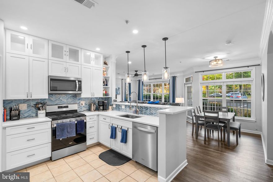 Recently Renovated 2 BR / 2 BA 1,182 sq. ft. First Level Condo in Securely Gated Westchester at Stratford Condo Community in Leesburg that comes with two permits for parking spaces! Upon entry to unit, you are met by entry foyer with tile flooring, coat closet, laundry closet with storage and open floorplan Kitchen / Living Room / Dining Room Combination floorplan with wide plank stylish vinyl plank flooring throughout most of the floorplan that connects to private balcony for exterior entertaining. Kitchen includes tile flooring, quartz counters, stainless appliances, 42" white shaker cabinets, custom backsplash, breakfast bar and pantry. Primary bedroom with large en-suite primary bathroom with soaking tub and separate stand-in shower that connects to large and convenient walk-in closet. Second bedroom is on the opposite side of the condo for ideal privacy between bedrooms and this bedroom includes closet and second en-suite bathroom with second soaking tub. As noted, property has in unit full size top load washer and front load dryer in closet with additional storage. Community also includes outdoor pool, fitness center, on-site management and community room with pool table that can be rented. Close to the Dulles Toll Road/267 and Route's 15 and 7 for commuting purposes and Leesburg and Dulles Airports. A great location and a beautiful condo, do not miss this one!