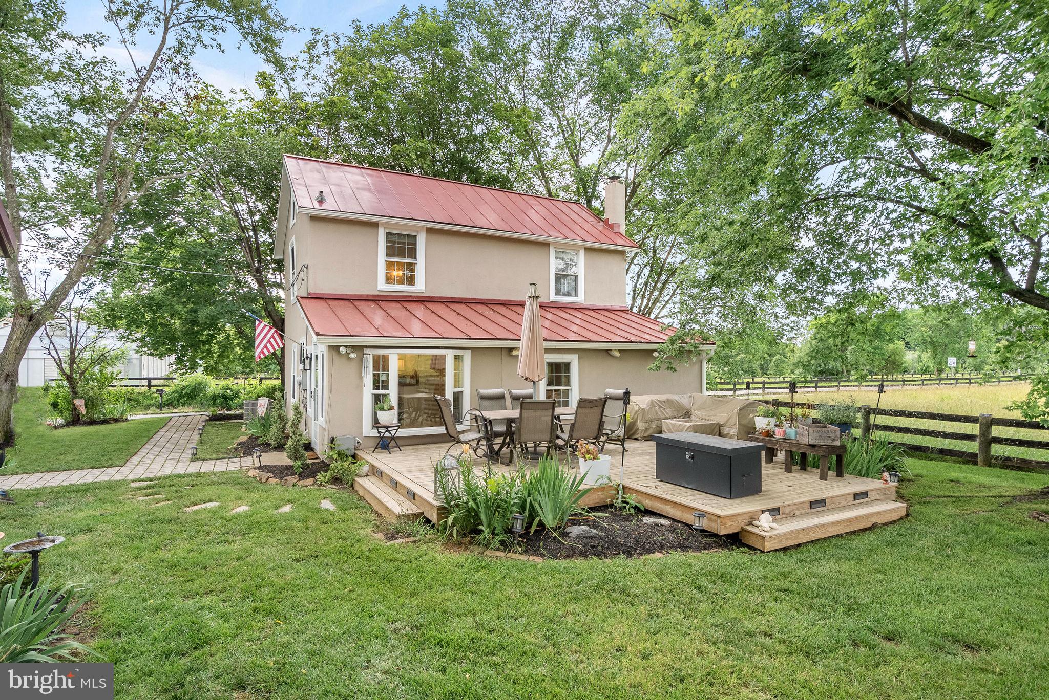 Charming 1900s Cottage with Scenic Views and Modern Updates
20078 Lincoln Rd, Purcellville, VA 20132
Imagine starting your day with a warm cup of coffee on the back deck, watching the sun rise over a picturesque hayfield. From the soft crackle of gravel beneath your tires as you pull into the drive, to the soothing sound of rain on the metal roof, this 1900s cottage captures the charm and serenity of country living.
This delightful two-level home has been tastefully updated while preserving its historic character. Enter through the dedicated laundry/mudroom and step into the beautifully refreshed kitchen, complete with quartz countertops, a new backsplash, and original bead board detailing. Bright and airy, the family room offers stunning pastoral views and flows seamlessly into a cozy eat-in nook featuring the original slate flooring and soaring cathedral ceiling.
The main level also includes a spacious bedroom and a fully renovated full bathroom with striking marble accents. Upstairs, two additional bedrooms share a charming Jack and Jill bathroom—perfect for family or guests. Fresh paint throughout brings a crisp, move-in-ready feel.
A rare blend of timeless character and modern comfort, this home is your peaceful escape in the heart of Purcellville.