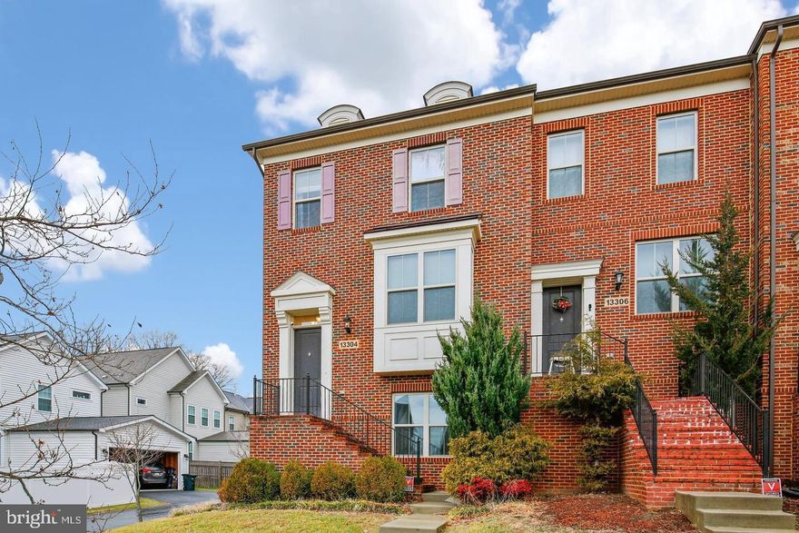 Improved Price to Sell. Stunning End-Unit Townhome in Sought-After Poplar Run Community. Welcome to this beautiful brick-front end-unit townhome featuring 3 spacious bedrooms, 3 full bathrooms, 1 half-bath, and a 2-car garage. The roof was replaced  6 months ago. The upgraded kitchen boasts granite countertops, stainless steel appliances, and hardwood floors, flowing seamlessly into a cozy living area with a fireplace.

Enjoy outdoor living on the huge maintenance-free deck just off the family room — perfect for entertaining or relaxing. Upstairs, you'll find generously sized bedrooms, a convenient upper-level laundry, and a luxurious primary suite with a spa-inspired bathroom.

Located in the prestigious Poplar Run HOA, residents enjoy access to resort-style amenities including pools, tot lots, a sandbox, nature trails, a clubhouse and pavilion, and a volleyball court.

Conveniently situated close to shopping, major highways, public transportation, and the ICC, this home offers both comfort and connectivity.

Don't miss this opportunity — this one won't last long!