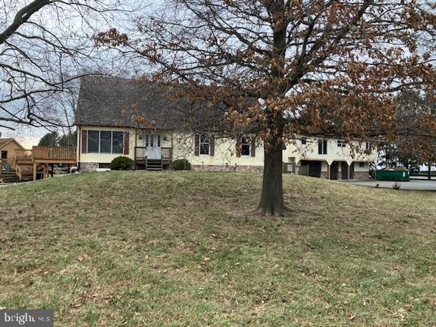 Potential abounds! Large Cape in need of finishing touches. 4+ acres with 4 stall barn 40' X 58' outbuilding with possible upstairs living space. New stainless steel appliances included.  Property being sold "AS IS"