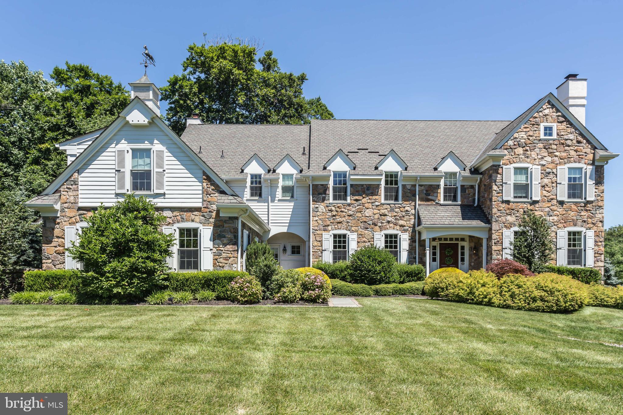 Don't miss this new virtual tour for this listing in the coveted neighborhood of White Horse, Newtown Square. Walk to Episcopal through your backyard! Now is the time to make this beautiful home yours ... with low taxes and one of the largest, most private lots in the neighborhood and the new exterior, this home is a true winner. The original owners are excited for the next owner to begin a new chapter in this gracious home that has been loved. In 2019 the exterior underwent a full renovation, all stucco was removed and replaced with Hardie Board siding. 56 Farrier Lane is a stunning, meticulously maintained stone home, that offers unbelievable privacy, lots of work from home space, all in the center of this fabulous walking neighborhood . This updated home was thoughtfully designed for family living, entertaining, or for a cozy retreat. This stately home sits on one of the largest lots in the neighborhood, backing up to woods for maximum tranquility. The property goes way back - all the way to Episcopal Academy. The scale of the lot, custom landscaping, and grand flagstone terrace offer privacy, while still allowing a warm sense of community in this fabulous neighborhood. The home was custom built in 2007 by award winning Nolen Company Builders. The floor plan is perfectly conceived, with the over-sized kitchen and breakfast room and 10 foot island serving as the heart of the home. The kitchen has always provided a great gathering spot, but is also a chefs dream with upgraded, professional grade Wolf and Subzero appliances. The home offers fabulous flow, as the kitchen opens into a great room with fireplace and crawford ceiling. The mudroom with 2 exterior entrances, walk in closet, powder room and desk off of the kitchen, connected to the 3 car over-sized garage, make daily living and unloading groceries or packages easy. On the 1st floor, the front to back grand foyer is centered between the formal living room and formal dining room with stately bar and butlers pantry. Beyond the gracious grand staircase you will find a cozy den or office with gas fireplace and french doors, and a formal powder room. The 1st floor has finished on site white oak hardwood floors throughout, with a rich dark walnut finish. The completely finished walkout lower level features upgraded 10 foot ceilings, a large family room, a full bath and a fitness room or bedroom, you choose! Unfinished areas offer loads of storage. Upstairs this home features 5 bedrooms, all with en suite custom baths, and an upstairs laundry. Master suite with sitting room or office, 2 large walk in closets, dressing area and very large marble bath with private water closet. Finished 3rd floor with carpet which could be used for storage, or to create a cozy loft. It is difficult to describe the level of care that went into designing and caring for this home, you really just need to come and see for yourself, walk the grounds, listen to the church bells ring at EA, and feel the peacefulness and richness of the community. This home, situated in the heart of everything, offers easy access to Wayne PA, Newtown Square (the new Whole foods shopping center!), Bryn Mawr, Devon, Malvern and Paoli.
