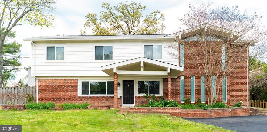 One of a kind expanded beautifully updated split level 2800 square feet, located just minutes from major thoroughfares, i.e. I395 & I495, a commuter's dream.  On the main level, this home features a formal dining room, adjoining  between a newly updated country kitchen and an enormous living room. A few steps up through the stairs ahead of the dining room leading up to the 2nd level features a cozy family room with a soaring cathedral ceiling and facing a 4 panels panaramic window, allowing in ample sunlight. Inconspicously tucked in a corner is a traditional fireplace stove, perfect to warm up the space in any chilly days.  Sharing the 2nd level is a study (library) large enough to be doubled as a guest's bedroom.  Located at a few more steps above the family room are the 3 bedrooms, a full bathroom and the master bedroom completed with its own master bathroom.  Each of the 3 bedrooms faces at least one large window welcoming in plenty of sunlight. The master bedroom is a unique retreat in itself with a 2nd level deck as a balcony, turning it into a perfect spot for outdoor breakfasts and nighcaps. Adding skylight windows to the cathedral ceiling and two  oversized windows opens up the master bedroom for ample nature sunlight. This home is recently updated with new paint and a new kitchen furnished with beautiful granite counter tops, new stove and built-in microwave.  Nature sunlight fills the kitchen through a panoramic window.  Beautifully gleaming hardwood flooring expands most of the main level and all of the upstair levels  to warm up the entire home.  Updates include: roof & gutter (2015), water heater (2020), new granite counter tops (2021), stove (2021), built-in microwave (2021); new paint (2021); newer windows.  Kindly limit 4 people per party during visit. Please wear masks for general public healthy safety.