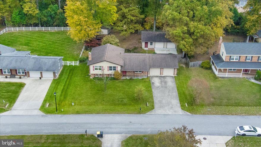 This is the one! A roomy split-level offering over 3,500 sq. ft. of living space blends everyday comfort with a serious garage and workshop set-up — nearly 2,000 sq. ft. of it! Bonus: brand-new carpet throughout the upper level and a kitchen featuring stainless-steel appliances. Its convenient location puts you minutes from restaurants, shopping, major routes, and more.
Inside, you’ll find three large bedrooms, 2.5 baths, upgraded flooring, a light-filled kitchen with breakfast room, and separate dining and living rooms. The lower level offers a rec room with a wood-burning fireplace, game room, half bath, laundry, utility space, storage, and backyard access.
Roof and siding replaced in 2016.
What truly sets this one apart: a 26′×28′ attached garage with 10′ doors, paneled insulated walls, and two attic access points with decked storage — plus a 40′×28′ detached garage with oversized bays, workshop space, in-wall gas heat, attic storage, and a front concrete pad. Additional outbuildings include a 12′×18′ run-in shed, 8′×12′ greenhouse, and a 36′×12′ lean-to with bluestone flooring — plus an outdoor play area.
The backyard is fully fenced, level, and bordered by tree-lined views. No HOA. Plenty of room to build, store, create, or tinker — both indoors and out.