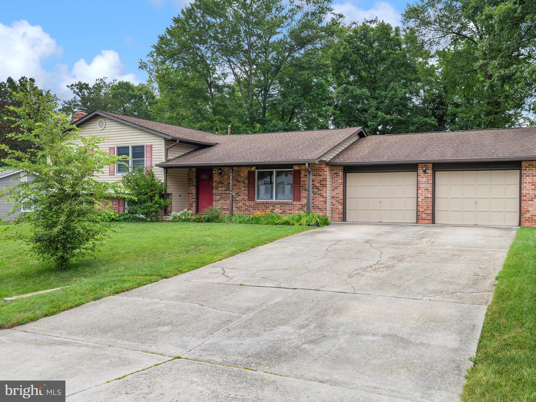 LET’S TALK ONE-OF-A-KIND!
Set on nearly half an acre in Glenn Dale, this split-level offers a rare combination of residential comfort and serious workspace. Inside, you'll find 3 bedrooms, 2.5 baths, upgraded flooring, a light-filled kitchen with breakfast area, and a separate dining room. The lower level includes a rec room with a decorative brick fireplace, half bath, laundry, utility space, and walk-up stairs to the backyard. Bonus: the roof and siding were replaced in 2016.
What truly sets this one apart:
A 26’x28’ attached garage with 10' doors, paneled insulated walls, and two attic access points with decked storage — plus a 40’x28’ detached garage with two oversized bays, workshop space, in-wall gas heat, attic storage, and a concrete pad out front. Additional outbuildings include a 12’x18’ run-in shed, an 8’x12’ greenhouse, a 36’x12’ lean-to with bluestone flooring, and even a tree house.
The backyard is fully fenced, level with tree-lined views along the back.
If you're looking for a property that is not part of an HOA and with room to build, store, create, or tinker — both indoors and out — this one delivers.