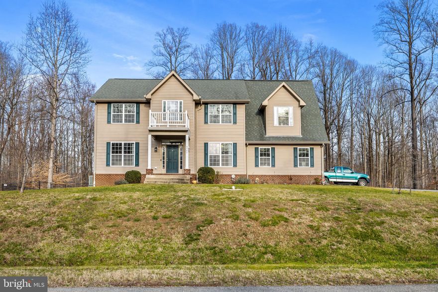 Welcome home to this beautiful Colonial in the peaceful neighborhood of Holbrook Estates!  This spacious home boasts 4 bedrooms, 3.5 bathrooms and sits on nearly an acre!  As you pull up the extended driveway you’ll notice there is plenty of room for guests! Between the two car garage and the 7 driveway spots, you’ll never have to worry about parking.  Upon entering the home you can’t help but notice the gleaming new LVP flooring (2023) throughout the main level.  To the left is a flex space that could be used as a home office or additional living room and on the right is the formal dining room.  As you make your way to the back of the main level, the kitchen and family room with a propane fireplace (2022) flow seamlessly together to provide the perfect space for entertaining.  A full laundry room (Washer 2023), hallway half bathroom, sliding glass door for access to the backyard and interior access to the garage round out the main level.  Making your way down the basement stairs, there are two unfinished rooms that were used for additional storage and an in house gym.  The fully finished rear basement area provides another living/flex space with a pellet stove for cozy winter nights.  New flooring, paint and sewage pump with alarm installed in 2022.  A full bathroom and walkout access to the backyard wrap up this level.  Ascending the stairs to the upper level is the massive primary bedroom with a large closet and en-suite full bathroom.  Three additional bedrooms and a full hallway bathroom complete the upper level.  Last but not least the huge fully fenced backyard with low maintenance deck offers endless opportunities for warmer weather get togethers!  With no HOA and a 1 year Home Warranty, buyers have the freedom and peace of mind to fully enjoy all this home has to offer!