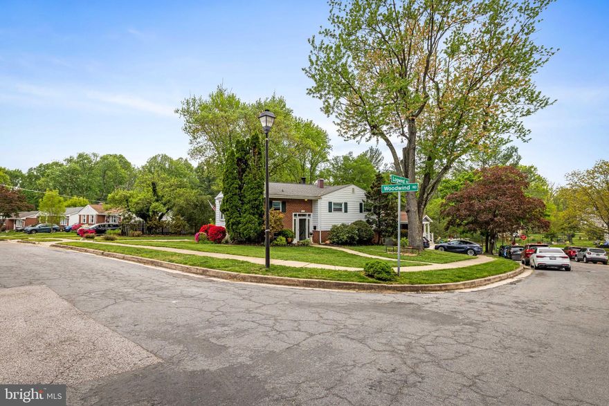 Nestled in the Woodwind neighborhood, backing up to Patapsco State Park and near Rollingwood Pool, this split-level home sits on a spacious corner lot on a quiet dead-end street. The upper level features a spacious living room with a wood burning fireplace, an extended kitchen with a bay window, and dining room with sliders leading to a large deck overlooking the backyard.  Three bedrooms and one bath complete this floor, with original hardwood floors in the dining room and two bedrooms.  The lower level offers plenty of flexibility, featuring a fourth bedroom, a full bath, two generous living areas, and utility and storage rooms.  A slider leads from the lower level to the rear yard.  Easy access to 695, 95, DC, Baltimore, and BWI make this location hard to beat.