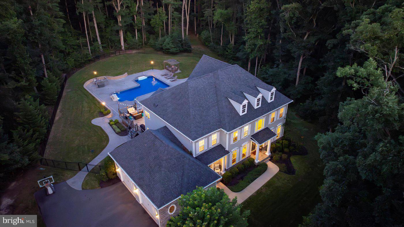 WELCOME HOME TO THIS BEAUTIFULLY CRAFTED CUSTOM COLONIAL, OFFERING NEARLY 6,400 FINISHED SQFT OF UPGRADED LIVING SPACE DESIGNED TO IMPRESS—WITH 6 BEDROOMS, 4.5 BATHS & A FLEXIBLE LAYOUT, THIS HOME IS AS FUNCTIONAL AS IT IS IMPRESSIVE! SITUATED ON 4.33 ACRES IN THE WOODS OF CATHARPIN, THIS HOME OFFERS A RARE BLEND OF PRIVACY AND CONVENIENCE—SURROUNDED BY MATURE TREES, THE HOME ENJOYS A PEACEFUL, WOODED SETTING, JUST DOWN THE ROAD FROM BOTH THE ELEMENTARY & MIDDLE SCHOOLS, WHILE ALSO LOCATED IN THE RIVERBEND SCHOOL DISTRICT, WITH A WIDE RANGE OF SHOPPING, DINING & EVERYDAY AMENITIES JUST A SHORT DRIVE AWAY! DUAL DRIVEWAY PILLARS WITH LANTERN LIGHTING WELCOME YOU INTO THE EXTENDED PAVED DRIVEWAY, LEADING TO A SIDE-LOADING FOUR-CAR GARAGE, WHILE THE FRONT OF THE HOME FEATURES BOTH PRIMARY & SECONDARY COVERED ENTRANCES, FRAMED BY CUSTOM LANDSCAPING THAT WRAPS AROUND THE PROPERTY! THE REAR OF THE HOME IS AN ENTERTAINER’S PARADISE, SHOWCASING A SPACIOUS TREX DECK & AN EXPANSIVE STAMPED CONCRETE POOL DECK SURROUNDING A CUSTOM SALTWATER POOL COMPLETE WITH A ROCK WATERFALL & DUAL FOUNTAINS. WHETHER HOSTING A CROWD OR ENJOYING A QUIET EVENING OUTDOORS, THERE’S NO SHORTAGE OF SPACE TO GATHER, DINE & UNWIND—WITH FEATURES INCLUDING MULTIPLE RETAINING WALLS, A FIREPIT AREA, A PERGOLA & A FULLY FENCED BACKYARD THAT TIES IT ALL TOGETHER! THROUGH THE FRONT DOOR, A GRAND TWO-STORY FOYER WELCOMES YOU WITH ARCHED ENTRYWAYS FRAMED IN CUSTOM TRIM, WHILE RICH HARDWOOD FLOORING FLOWS SEAMLESSLY THROUGHOUT THE MAIN LEVEL & CONTINUES INTO THE UPPER-LEVEL HALLWAY, SETTING A TONE OF WARMTH AND SOPHISTICATION FROM THE START! THE SPACIOUS LIVING ROOM OFFERS A WELCOMING RETREAT OPPOSITE THE FORMAL DINING ROOM, WITH ELEGANT CHAIR RAILING, CHANDELIER LIGHTING & PLENTY OF ROOM TO HOST MEMORABLE GATHERINGS, IN ADDITION TO A BUTLER’S PANTRY AREA, PRIVATE OFFICE WITH SEPARATE ENTRANCE ACCESS & CONVENIENT POWDER ROOM ADD THOUGHTFUL FUNCTION & STYLE TO THIS FRONT SECTION OF THE MAIN LEVEL! THE LARGE FAMILY ROOM FEATURES A STUNNING COFFERED CEILING & ABUNDANT NATURAL LIGHT FROM WINDOWS OVERLOOKING THE WOODED REAR, CENTERED AROUND A FLOOR-TO-CEILING STONE GAS FIREPLACE WITH A BEAUTIFUL WOODEN MANTEL! THIS GOURMET KITCHEN BOASTS AMPLE GRANITE COUNTERTOP SPACE, HIGHLIGHTED BY A LARGE CENTER ISLAND WITH A BREAKFAST BAR, EQUIPPED WITH GE STAINLESS STEEL APPLIANCES INCLUDING DUAL WALL OVENS & A GAS COOKTOP WITH VENT HOOD, A GOOSENECK PULL FAUCET, SOFT-CLOSE CABINETS PROVIDE PLENTY OF STORAGE, WHILE A WALK-IN PANTRY & SPACIOUS BREAKFAST ROOM COMPLETE THIS FUNCTIONAL AND INVITING CULINARY SPACE! OFF THE BREAKFAST ROOM, A MUDROOM FEATURES A CUSTOM DROPZONE WITH CUBBY STORAGE & COAT HOOKS, WHILE DIRECTLY OPPOSITE, A SPACIOUS SUNROOM FILLED WITH NATURAL LIGHT OFFERS A PASS-THROUGH WINDOW & COUNTER TO THE KITCHEN ALONG WITH SLIDING GLASS DOOR ACCESS TO THE REAR DECK! TWO SEPARATE STAIRCASES LEAD TO THE UPPER LEVEL WITH A CURVED OVERLOOK TO THE FOYER! THROUGH DOUBLE DOORS THE HUGE OWNER’S SUITE AWAITS FEATURING A SITTING AREA, LARGE TRAY CEILING, ONE WALK-IN CLOSET WITH CUSTOM STORAGE & AN ENSUITE WITH SPLIT CULTURED MARBLE VANITIES, A SOAKING TUB, OVERSIZED SHOWER WITH CUSTOM TILING, BENCH SEAT & FRAMELESS GLASS DOOR, A PRIVATE WATER CLOSET & A SECOND, LARGER WALK-IN CLOSET! THE UPPER LEVEL IS COMPLETE WITH THREE ADDITIONAL SPACIOUS BEDROOMS FEATURING AMPLE CLOSET SPACE, INCLUDING ONE WITH AN ATTACHED FULL BATH, WHILE THE OTHER TWO SHARE A JACK & JILL FULL BATH & A SEPARATE LAUNDRY ROOM CONVENIENTLY LOCATED IN THE HALLWAY! DOWN TO THE FINISHED WALKOUT BASEMENT, THE HUGE REC ROOM IS PERFECT FOR A HOME THEATER, GAME ROOM, OR ADDITIONAL LOUNGE SPACE—WITH WALKOUT ACCESS TO THE REAR POOL AREA, ALONG WITH THE FIFTH & SIXTH BEDROOMS BOASTING GENEROUS CLOSET STORAGE, A FOURTH FULL BATH, A DEDICATED HOME GYM ROOM & AN EXPANSIVE STORAGE ROOM! DO NOT MISS YOUR OPPORTUNITY TO OWN THIS INCREDIBLE CUSTOM HOME! CALL TODAY TO SCHEDULE YOUR SHOWING BEFORE IT'S TOO LATE!