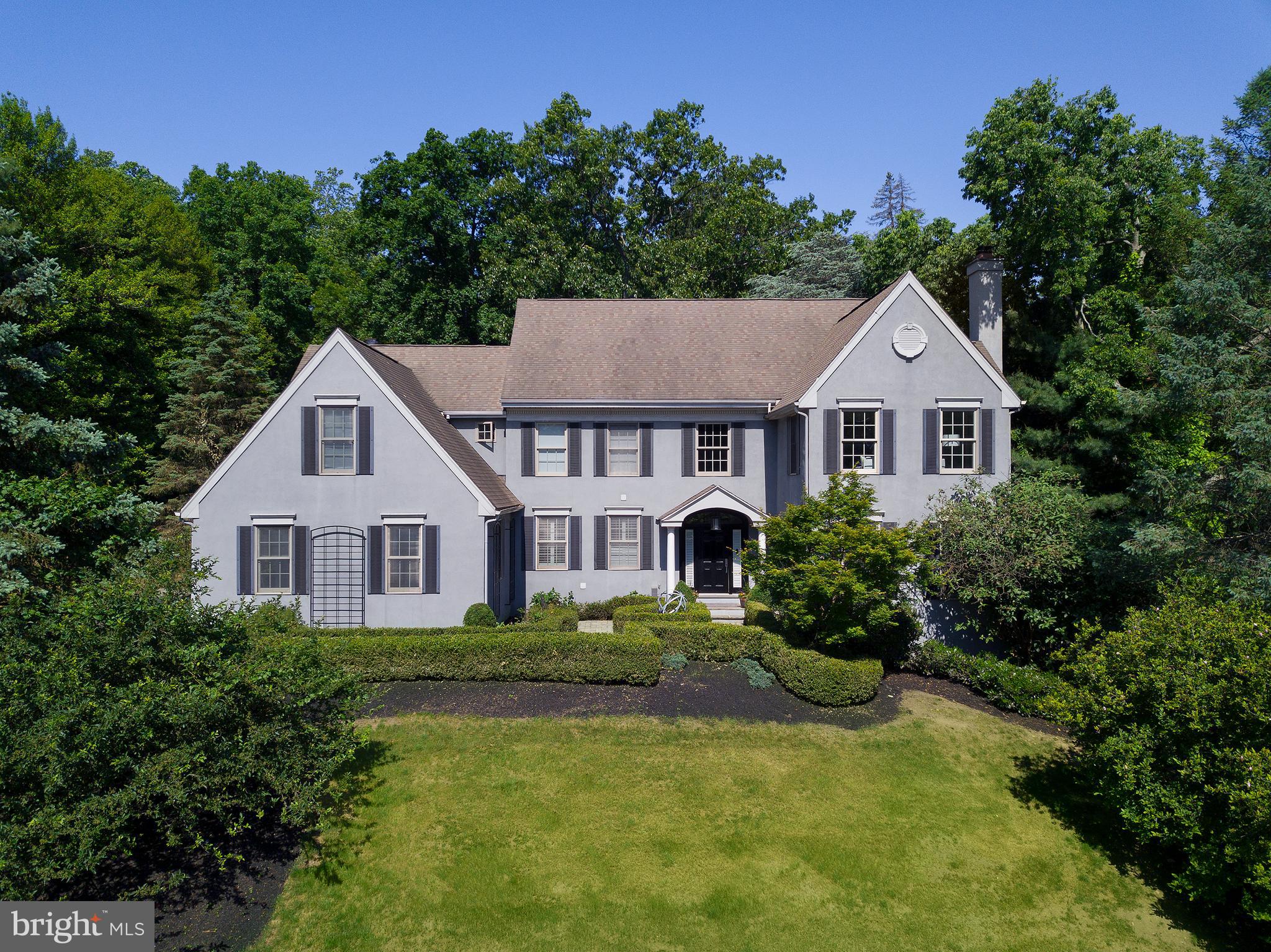 Welcome to this exquisite home located in Wayne, within the prestigious Tredyffrin-easttown school district. As you enter, you are greeted by a grand two-story entranceway, setting the tone for the elegance and sophistication that awaits you. Hardwood floors adorn the entire first floor, adding a touch of luxury. To the right of the entranceway, you'll find a formal living room featuring a gas fireplace, creating a warm and inviting space for gatherings or quiet relaxation. The living room seamlessly opens to a formal dining room, providing a seamless flow for entertaining guests or hosting formal dinner parties. The dining room leads to a spacious kitchen that that boasts a large center island and a charming breakfast room, offering the perfect spot to enjoy your morning coffee. The kitchen is equipped with top-of-the-line stainless steel appliances. The white cabinets paired with gray quartz countertops create a modern and sleek aesthetic. Additionally, there is a built-in wine cooler and an abundance of storage with plenty of cabinets and shelves, making it a chef's dream. From the kitchen, a sliding glass door leads out to a deck and a spacious yard, offering a serene outdoor retreat for relaxation or entertaining. Adjacent to the kitchen is a magnificent two-story vaulted family room, complete with a second gas fireplace, adding warmth and charm to the space. There is also a convenient desk area with built-ins, perfect for working from home or completing daily tasks. The main level of the home also includes a laundry room with built-ins and a mudroom, providing functionality and organization. The mudroom leads to a three-car attached garage, and there are back stairs that lead to the second floor for added convenience. A first-floor office off the foyer offers a private space for work or study. A first-floor powder room adds convenience for guests. On the second floor, you'll find four spacious bedrooms and three full baths. One of the bedrooms is an en-suite, offering privacy and comfort. The other two bedrooms share a well-appointed hall bath. One of the bedrooms even features a door that provides access to a large closet/attic space, ensuring ample storage options. The primary bedroom is a true retreat, featuring a large bathroom with a double vanity, a sunken-in tub, a separate toilet area, and a walk-in closet. Additionally, the primary bedroom boasts a generous sitting room, perfect for relaxation or creating a private sanctuary. The lower level of the home is fully finished and offers additional living space. It includes a den and a billiard room, providing versatility for various leisure activities. There is also a fifth bedroom and a full bath, making it ideal for guests or as a private space for family members. Storage closets are plentiful, ensuring that your belongings are kept organized. This lovely home in Wayne offers luxurious living with its thoughtful design, high-end finishes, and a prime location, making it a truly remarkable home.
