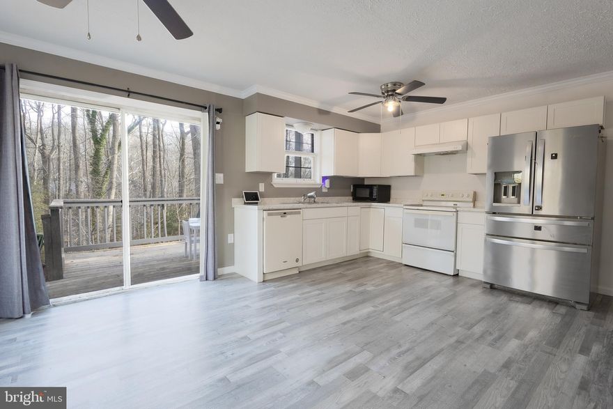 $5,000 clossing help with full price offer!  Charming 4-Bedroom Home in a Peaceful Wooded Setting at the end of a Cul-de-sac! Perfect for First-Time Buyers! Welcome to this well maintained 4-bedroom, 2.5-bath open concept home, tucked away at the end of a quiet cul-de-sac in a serene wooded setting. Thoughtfully updated and move-in ready, this home is ideal for first-time homebuyers looking for comfort, space, and style. Step inside to find fresh paint throughout and an airy, open layout perfect for everyday living and entertaining. The heart of the home is the spacious kitchen, which opens to a wonderful deck—ideal for morning coffee or evening gatherings while enjoying the natural surroundings. The fully finished lower level offers incredible versatility, featuring an additional bedroom, a convenient half bath, new carpet, and plenty of space for a home office, rec room, or guest suite. Don't miss this opportunity to own a peaceful retreat that combines privacy, functionality, and charm—all in a location you'll love to call home.
New Roof in 2023, New HVAC in 2023, New Water Heater in 2023, New BAT (Best Available Technology) Septic System.