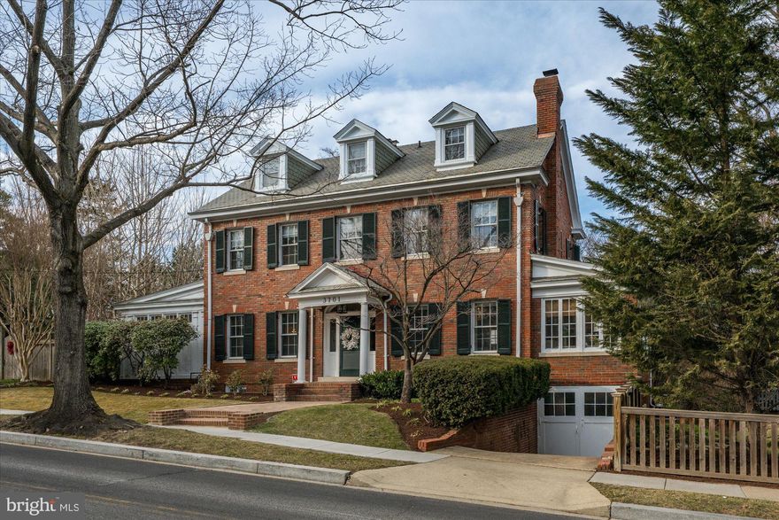 Welcome to 3701 McKinley Street NW, an exquisite and stately 1923 Georgian residence that masterfully blends historic charm with modern elegance. Set on an expansive 10,000+ square foot lot in the heart of Chevy Chase, DC, this 6BR/4.5BA home captivates with its grand proportions, soaring 10-foot ceilings, and meticulously refined interiors.

From the moment you step through the gracious entryway of this true center hall home, you are welcomed by an atmosphere of sophistication and warmth. Thoughtful and tasteful updates throughout the home seamlessly complement its architectural integrity, preserving intricate moldings, original hardwood floors, and timeless details while enhancing comfort and livability.

The generous main level is designed for both grand entertaining and everyday living, featuring multiple elegant formal and informal sun-lit spaces, including an exquisite formal dining room, a separate grand formal living room with adjacent parlor and sunroom, and a beautifully appointed kitchen/family room/mudroom addition designed by GTM Architects and built by Zantzinger. This hub of the home opens to an expansive patio, creating a modern everyday living area that ties seamlessly with the original architectural elements of the home. Upstairs, the luxurious primary suite offers a serene retreat, accompanied by four additional spacious bedrooms, two additional well-appointed baths, and an office. The finished lower level has something for everyone, with a guest suite, a large recreational space with room for ping pong and movie nights, a separate gym, wine cellar, wet bar, and access to the attached garage.

Outside, the quarter acre lot presents a rare opportunity for expansive play spaces, multiple outdoor entertaining areas, a separate parking pad and driveway/garage, all serenely private and within moments of the vibrant amenities of the Connecticut Avenue corridor.

A truly exceptional offering, this distinguished and lovingly maintained home exudes warmth and is a testament to timeless architecture, impeccable design, and unparalleled character. Welcome home!