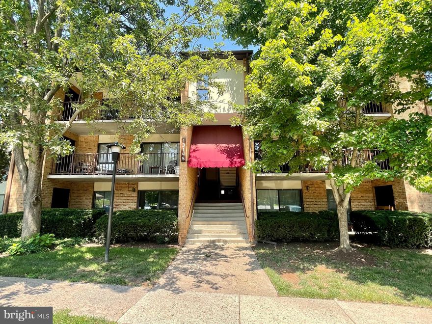 Excellent opportunity to own an affordable and updated three-bedroom, two-full bathroom condo in a superb location. Kitchen updates include stainless steel appliances, granite countertops, and wide plank tile flooring. This eat-in kitchen also delivers a warm & cozy wood burning fireplace, with ample cabinet & storage space. Both bathrooms have been freshly painted and revamped with new toilets and faucets.  Stackable front-load Washer & Dryer in unit. Condo amenities include a large & well maintained outdoor pool, assigned parking space, community room, hobby room, exercise room, and additional storage space in the basement. Monthly condo fee also includes water, trash/snow removal, and building/lawn maintenance. Conveniently located within a half mile of Kingsview Village Center, which delivers Starbucks and Giant Food. The exceptional Kentlands Market Square which has endless shopping, entertainment, and dining options is less than a 10 minute drive. Come put your finishing touch on the spacious condo with great potential.