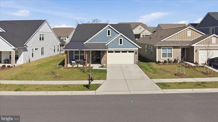 NEW PRICE! Summertime Fun in Lake Frederick!    -  Welcome to 55+ living at its finest in the sought-after Lake Frederick community—where quality shines both inside and out. This like-new Craftsman-style home, built in 2023, offers the perfect blend of luxury, comfort, and effortless main-level living.

From the moment you arrive, the charming fiber cement exterior sets a warm and sophisticated tone. Step inside to a thoughtfully designed, light-filled layout featuring stunning hardwood flooring and high-end finishes throughout.

The gourmet kitchen is a true centerpiece, boasting abundant cabinetry, a massive island ideal for gathering, and a spacious walk-in pantry sure to impress any home chef. The adjoining dining area flows seamlessly to a custom patio—perfect for indoor-outdoor entertaining—while the inviting family room features a cozy gas fireplace.

The main-level primary suite is a private retreat, complete with a spa-like bath featuring a large walk-in shower with bench seating, dual vanities, and a generous walk-in closet. A second bedroom, full bath, and a private office with glass doors complete the main level.

Upstairs, you'll find a versatile loft space, an additional spacious bedroom with a walk-in closet, and a beautifully designed full bath—perfect for guests or extended stays.

Additional features include a spacious two-car attached garage with excellent storage, a concrete driveway, a sprinkler system, an EV charging station, and an invisible fence with two collars. The 0.14-acre lot provides the perfect balance of outdoor space to enjoy.

Beyond the home, enjoy resort-style community amenities including a stunning pool with heated, indoor, and saltwater options for year-round enjoyment. The beautifully maintained grounds encourage leisurely walks and social connections, creating a true sense of community.

This is more than just a home—it’s a lifestyle. Experience the perfect balance of modern elegance and relaxed living in Lake Frederick. Your next chapter starts here.