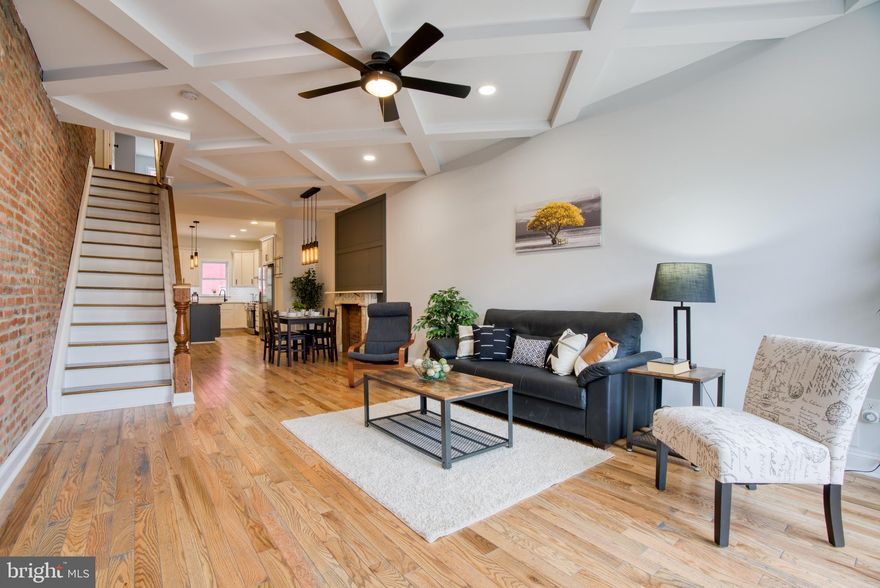 ******final CHAP is pending***Located just steps from Patterson Park, this home has been completely renovated from top to bottom and with the CHAP guidelines. This large home has 4 true bedrooms and 3 full baths. Upon entering you'll be taken back by the gorgeous coffered ceiling, marble fireplace hearth, and hardwood floors throughout. The kitchen, while large, has an island w/ butcher block, Quartz counters, stainless steel appliances, a stand alone hood, and reclaimed wood shelving, pedant lights, and a subway tiled back splash. Upstairs is the master suite and 2nd bedroom and another full bath. The bathrooms keep the "farmhouse" style with more reclaimed wood shelving and a chic black/white contrast. The basement is fully finished with high ceilings, 2 bedrooms, a full bath, and a laundry area. This house also has a PARKING PAD!