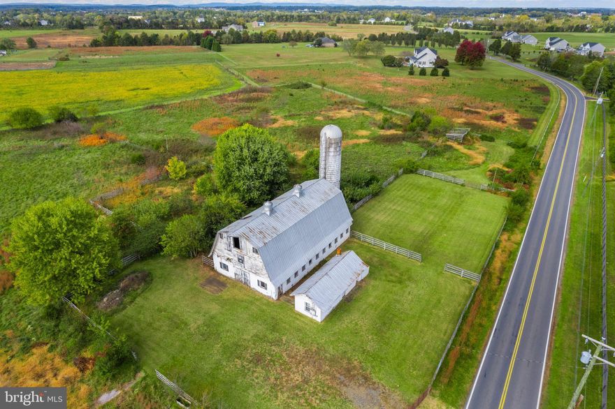Amazing 10 acre property featuring a 10 stall horse barn, milking home and silo.