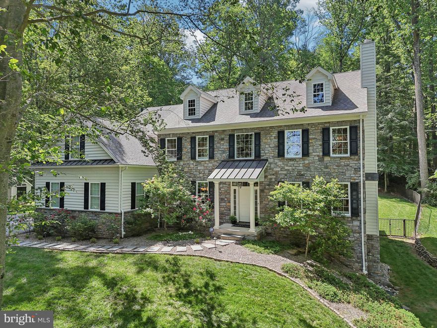 Nestled on a rare 2.2-acre lot, this luxurious property offers inviting curb appeal with scenic tree lined views. Step inside to find a thoughtfully designed interior that feels like a model home, with the warmth and charm of a lived-in residence. 

Rich site finished, solid oak floors greet you upon entry and proceed throughout the main floor and upper hall. A formal dining room with classic wainscoting sets the stage for memorable gatherings, while the living room features a wood-burning fireplace and French doors to a private office. The two-story great room, crowned with an 18’ coffered ceiling, showcases a striking stone gas fireplace with a Kozy Heat direct vent insert, framed by four expansive casement windows that reveal sweeping views of the manicured, fenced grounds.

The open-concept kitchen, breakfast area, and family room create a seamless flow for both intimate living and grand entertaining. The kitchen is tastefully adorned with Century soft-close cabinetry, Bosch appliances, glass-front display cabinets with interior lighting, and a generous island for casual dining. A butler’s pantry with a wine refrigerator and subway tile backsplash adds refined convenience. French sliding doors lead to one of two custom patios enhanced by professionally designed landscape lighting, making this space ideal for al fresco dining or evenings by the fire pit. A custom-built mudroom offers tailored storage solutions and completes this level.

Upstairs, the primary suite is a private sanctuary featuring a spacious bonus room, dual walk-in closets with California Closet systems, and a spa-inspired bath with dual vanities, a seamless walk-in shower, and designer finishes. A princess suite and two additional bedrooms—each with custom California Closet systems—share a beautifully appointed hall bath. 

Perfect for multigenerational living, the expansive finished walk-out lower level offers luxury vinyl plank flooring, a full bath, flex space, expansive family room, and a whimsical under-stair reading nook with built-in storage. 

Not to be missed, the side-entry, three-car garage boasts a professionally installed epoxy floor and bespoke cabinetry giving this space versatility and character. Additional features include solid wood doors throughout the home, professionally installed Hunter Douglas blinds, transom windows that flood the home with natural light and a convenient storage shed for your landscaping needs. Enjoy the efficiency of gas heat on the upper level and a whole-house Generac gas-powered generator for peace of mind. 

Located within the award-winning West Chester Area School District, and mere minutes from the Malvern train station, West Chester Borough, and the Main Line, this exceptional estate delivers unparalleled craftsmanship, comfort, and convenience. This is more than a home—it’s a lifestyle. Schedule your private tour today and experience it for yourself.