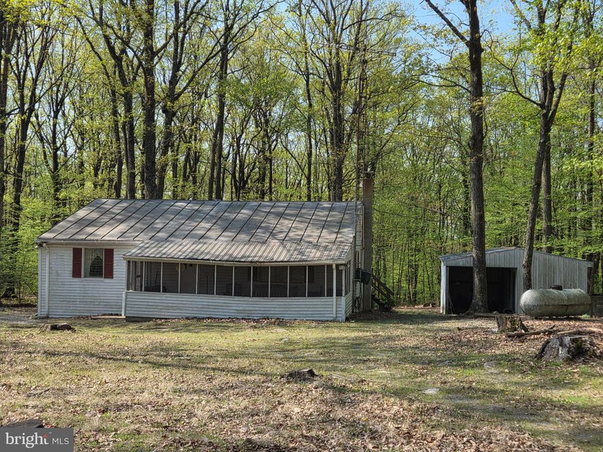 Looking for serene and private living?  Welcome to 34 Spring Lane!  Featuring one level living, two spacious bedrooms and an open floor plan, you have plenty of space to entertain and relax.  Located in a private wooded area, you will find peace and quiet to help you unwind.  Large detached garage featuring a workshop area for all of your hobbies.  So many opportunities with this beautiful property await!  Set up your showing today!