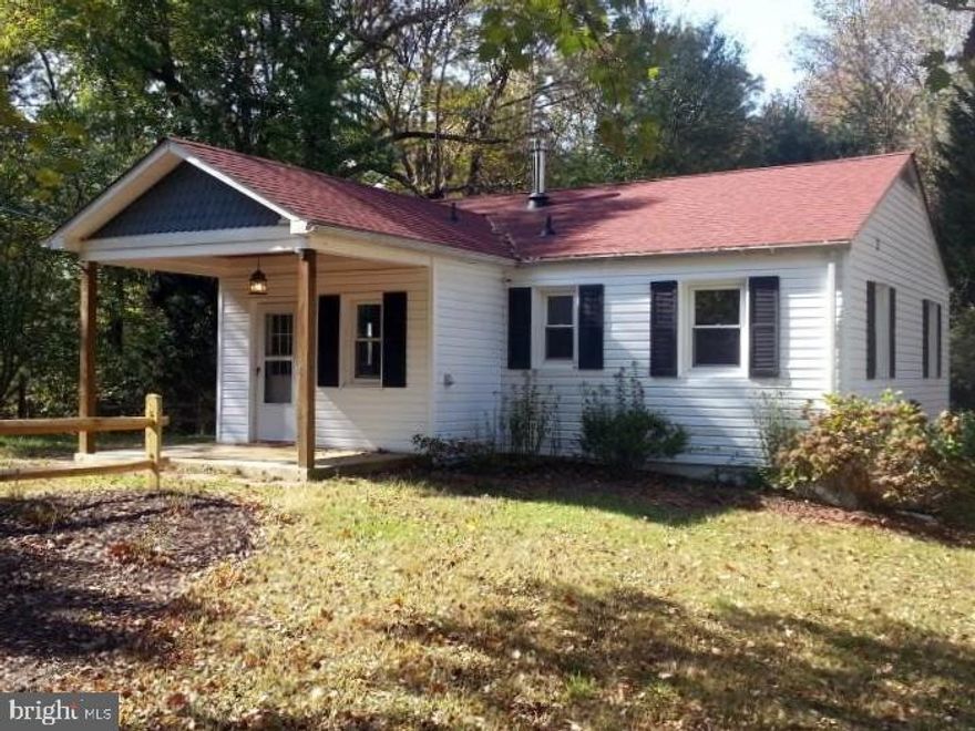 Well maintained 2 bedroom / 1 bathroom ranch home, built circa 1955, in very quiet setting, just 15 minutes to Andrews! The home is co-located on a very private 12 acre lot along with the original 1912 farmhouse. The lot is unique with a lot of privacy, and is tucked into the quiet community/development of "McMansions" called North Keys Estates with great roads for walking, jogging, and riding bikes. The lot is buffered all around by woods with the exception of just one direction, which overlooks a historic preservation lot containing 2 barns. House was occupied by a master carpenter for many years who built the large backyard deck, front porch, and screen porch. Relax and catch some rays on the deck, do some barbecuing, or fall asleep to the gentle breezes in the screen porch. Gorgeous hardwood floors in living room and bedrooms. Home is already wired for Comcast High Speed Internet. There is one Cable TV outlet in the living room, and one Cable TV outlet in each bedroom. Please note: FIOS is not an option. The driveway is partially paved and part stone and is shared with the tenants in the 1912 farmhouse. Plenty of parking. Renter is responsible for their own snow removal. There's a dedicated 8 x 16 foot Storage Shed for additional storage that has a ramp, built-in shelves, lights and outlets. Much of the interior of the home was essentially gutted and rebuilt about 10 years ago - with new bathroom and kitchen. Details include crown molding and nice ceiling fans in each room. In addition, more recent updates include: - Some New Windows, New Back Door, New Screen Doors on Screen Porch and Deck just power washed and re-stained (June 2020) - Newer high efficiency washer and dryer (installed in Dec 2018) - Updated landscaping and tree trimming - Newer Over-the-Stove Microwave installed in kitchen - Paver walkway installed around front porch. - Highly energy efficient 5  spray R-20 open cell foam insulation in crawl space, as well as new R-49 fiberglass blown insulation in attic to help keep the electric bill low. - Newer roof - High efficient Hot Water Heater - Electric Panel replaced and upgraded to 220 service. Heating - Each room has electric baseboard heaters installed. Water is from a local well on the property. There is no charge for water/sewer. Water pressure is good. The home has several window air conditioner units that are more than powerful enough to cool the house, when needed. The units are stored in the storage shed until needed. Due to the high efficiency insulation, the house usually stays pretty cool in the summer and fairly warm in the winter. Trash service is paid for by the landlord. Home is ideal for folks who work at Andrews AFB. Available 7/1. Home will only be available to be shown on weekends.