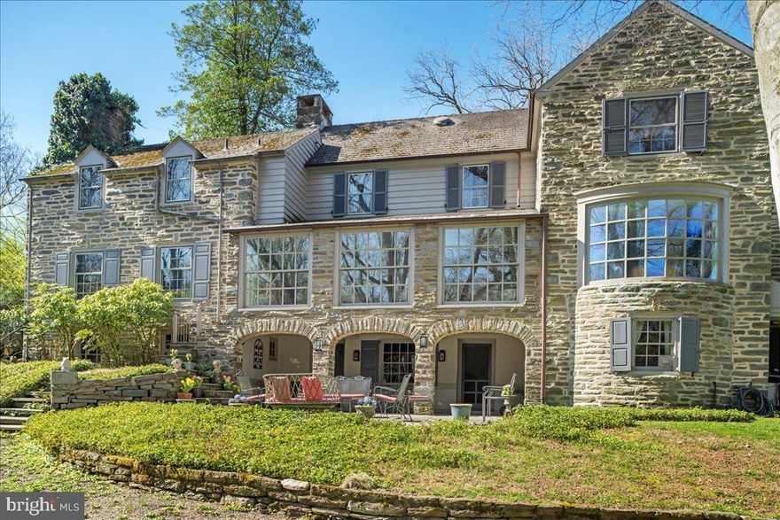 We are thrilled to introduce a classic center hall stone colonial in an ideal walk-to Wyndmoor location. Tucked away on a quiet cul de sac, “Hillbrow” was built by noted builder Melvin Grieb in 1941 and is beautifully sited on two spectacular wooded acres.The first floor features a brightly lit, gracious floor plan with coveted architectural details, millwork and wide plank black walnut floors. Enter a gracious center hall leading to a generous family room, formal living room with fireplace and handsome paneled library your right, and dining room to your left, all with spectacular views to the outside. Gourmet kitchen, Butler’s pantry and generous breakfast room complete the scene. Upstairs, in addition to a spacious, light-filled primary suite, three additional bedrooms and hall bath. Partially finished lower level, just waiting for gym and media room and an abundance of storage. 4 bedrooms/2.1 baths - Attached 2 car garage. Outside, beautifully designed tiered terraces overlooking a setting that will simply knock you out! All this, creating an extremely private setting within walking distance to both Wyndmoor and Chestnut Hill villages, trains to Center City and 90 minutes to Manhattan.