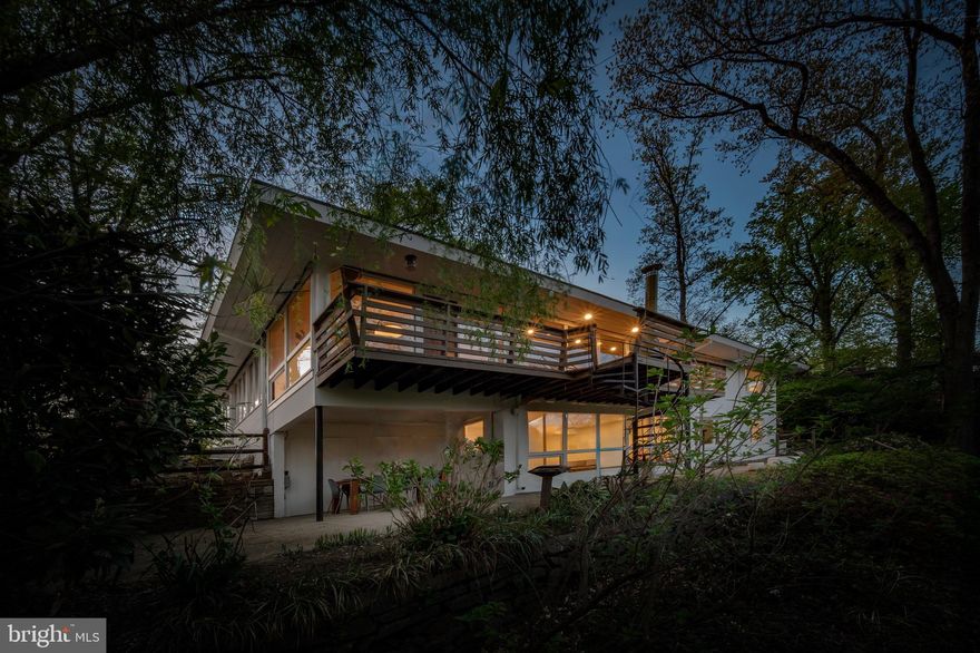 Extensively renovated in 2024–2025, this exceptional private waterfront residence in the sought-after Lake Barcroft community offers breathtaking water views.  Thoughtfully reimagined for modern living, yet has kept the Mid-Century Modern charm, the home features four bedrooms and four fully remodeled bathrooms. A redesigned floor plan enhances flow and functionality. Two level home with main level living! The main level showcases a luxurious primary suite complete with a custom walk-in closet and spa-inspired en-suite bath featuring a double vanity, walk-in shower, and towel warmer. Throughout the home, you’ll find new 7.5-inch wide European white oak engineered flooring with radiant heat beneath most of the floors, as well as a full-house radiant heating system with individual room controls. The stunning new kitchen is outfitted with Bosch appliances, a Forno refrigerator, quartz marble countertops and backsplash, a peninsula with seating and storage, and a cooktop with wall-mounted pot filler, all enhanced by a large new window above the sink.  Don't miss the hidden door from kitchen to oversized one car garage!  

Additional upgrades include new recessed lighting, baseboards, interior and exterior doors with Emtek hardware, a tankless gas water heater, updated electrical components, built-in closet systems in all bedrooms, and fresh interior and exterior paint. Both wood-burning fireplaces—located on the upper and lower levels—feature new Heath Ceramics tile and are plumed for gas conversion. 

The exterior is equally impressive, featuring multiple outdoor spaces designed for entertaining to include private front courtyard, deck across rear of home with beautiful views and spiral staircase down to lower level patio. Extensive landscaping and hardscaping designed to enhance natural light and maximize lake views. The fenced-in yard has been thoughtfully cleared and improved, with a newly added fire pit area by the water—perfect for relaxing evenings and waiting for your boat along your private waterfront.

Located within the established Lake Barcroft community in Falls Church, Virginia, this home offers access to a unique wooded setting and five private resident-only beaches. Known for its welcoming atmosphere, the neighborhood hosts a variety of social events throughout the year, including the beloved Fourth of July fireworks over the lake, making this a truly special place to call home.