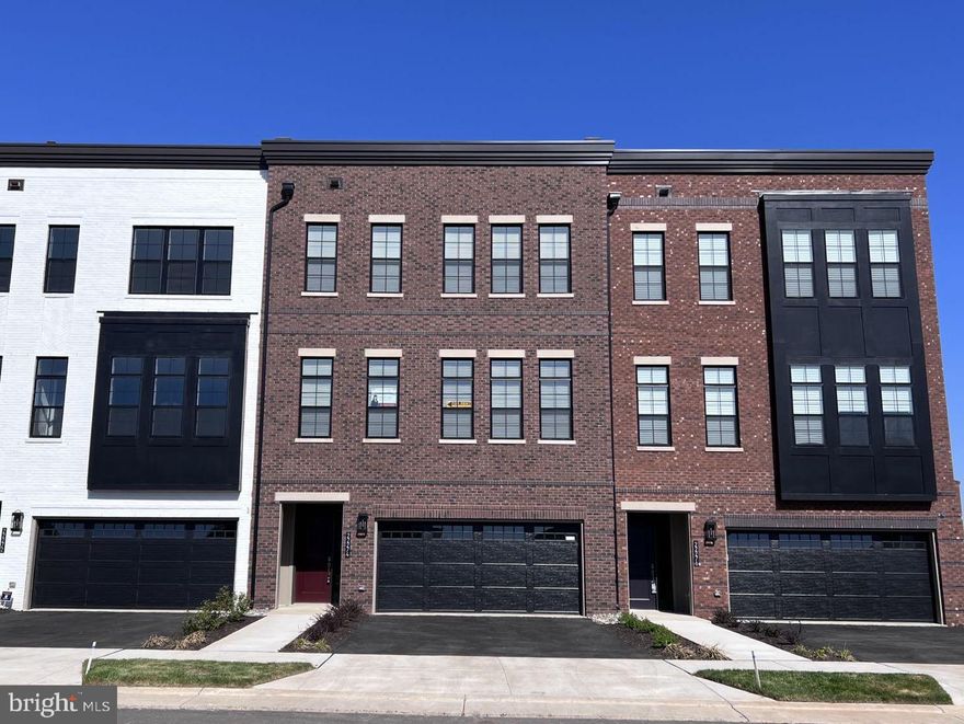 2 yr new , Elevator luxury TH. Within walking distance, offering convenience and accessibility to much of the Washington DC with Ashburn Station METRO! 4 Level TH showcasing an appealing modern design. First floor hosts recreation room, big bedroom/office and full bath room. The heart of this home is the second floor, which features an open-plan layout among the formal living & dining areas, gourmet kitchen, and a large deck. Three bedrooms including the owner's suite are situated on the third floor. Fourth floor includes a half bath & a terrace that enhances outdoor enjoyment |Elevator inside the home!! hardwood floors through out the house. 10 feet high main level, front open Washer & Dryer @ bedroom level | Easy access to upscale dining, shopping & recreation including Dulles Landing, Dulles Town Center, Tysons Corner Center, & Loudoun Station. Excellent access to Dulles Toll Road/Rt. 267, Route 7 and Route 28 | Excellence in style, function & location