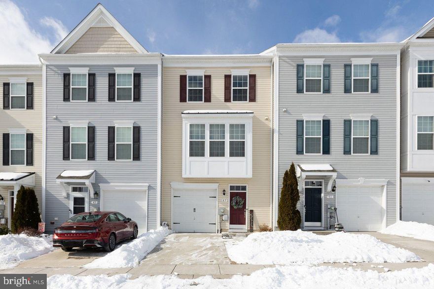 Discover the charm of this beautifully designed Colonial townhouse nestled in the desirable Riverside Villages community. With 2,198 sq. ft. of thoughtfully laid-out space, this home is perfect for those seeking comfort and functionality. Step inside to find a warm and inviting interior featuring low maintenance luxury vinyl plank flooring on three finished levels. The heart of the home is the spacious kitchen, complete with upgraded countertops, a central island, and stainless steel appliances, making it a delightful space for culinary adventures. The open floor plan seamlessly connects the kitchen to the family room, ideal for entertaining or enjoying quiet evenings at home. Natural light floods through energy-efficient windows, highlighting the elegant details throughout. The primary bedroom walk-in closet offers ample storage, while the convenient upper-floor laundry adds to the ease of daily living.  There are three total bedrooms upstairs and a full bath and possible fourth bedroom on the walk in level. Outside, enjoy your large deck perfect for morning coffee or evening relaxation. The exterior features include sidewalks and street lighting, enhancing the community's charm. With an attached garage and additional parking options, convenience is at your fingertips. The association takes care of common area maintenance and common road snow removal, allowing you to enjoy your home without the hassle. This property is not just a house; it's a place to create lasting memories. Don't miss the opportunity to make it your own!