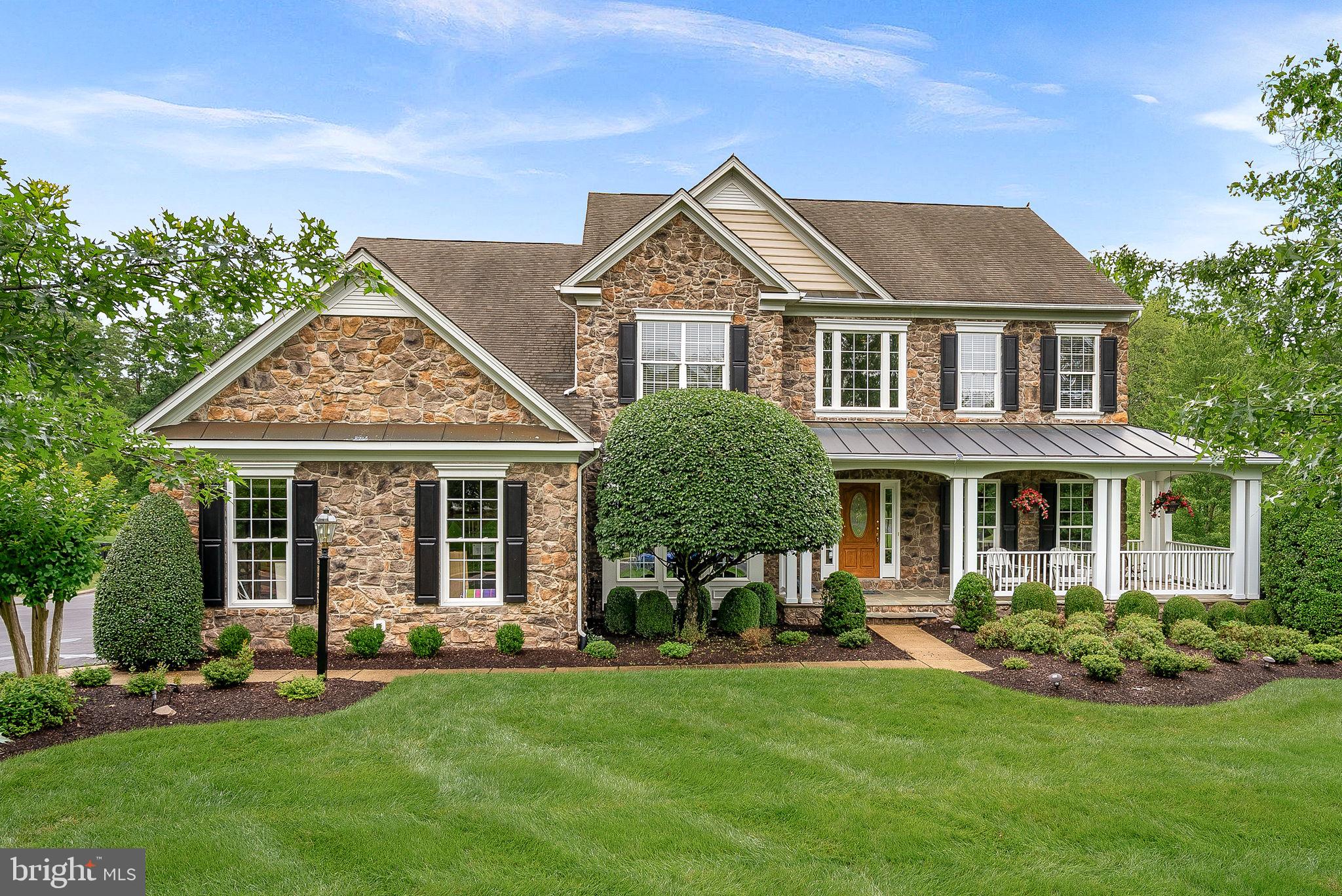 **OPEN SATURDAY & SUNDAY, 1-4** Welcome to this exceptional, meticulously maintained colonial that's been thoughtfully renovated with luxurious upgrades and modern conveniences throughout. Perfectly designed for both everyday comfort and stylish entertaining, this home offers a warm and welcoming layout on a premium 1.25-acre lot.
Step into the sun-drenched two-story foyer, where elegance meets functionality. The fully remodeled gourmet kitchen is a true chef’s dream, featuring custom glass-front appliances, quartz countertops, a hybrid built-in microwave that also functions as a secondary oven—ideal for hosting holiday meals or dinner parties. Just off the kitchen, the butler’s pantry is equipped with double wine refrigerators for effortless entertaining.
Upstairs, the home boasts generously sized bedrooms and three full baths. The primary suite is a serene retreat with beautifully designed custom closets and a fully renovated spa-inspired bath complete with high-end finishes, a jacuzzi tub and a relaxing steam shower. One of the secondary bedrooms has been transformed into a custom dressing room but can easily be converted back into a spacious bedroom if desired.
The finished walk-out basement offers endless possibilities with a fifth bedroom, full bath, media room, expansive recreation space, and a custom bar. The fully finished walk-out basement offers endless possibilities with a fifth bedroom, full bath, media room, expansive recreation space, and a custom bar. Whether you're hosting game nights, setting up a home gym, or simply enjoying quiet evenings, the lower level adapts beautifully to every lifestyle.
Step outside into your own private resort. The beautifully landscaped backyard showcases an inground heated pool with a tranquil waterfall and dramatic fire bowls for an unforgettable day-to-night ambiance. Enjoy evenings gathered on the expansive screened and unscreened Trex decks, both recently restored and enhanced with lighted stairs. The screened-in deck also features built-in speakers, part of the full-home surround sound system—perfect for music, movie nights, or outdoor entertaining.
The lush lawn stays vibrant with the help of a fully automated sprinkler system, and a sizable backyard shed provides extra storage for tools, equipment, or outdoor toys.
The spacious three-car garage offers even more to love, featuring durable, sound-absorbing vinyl tile flooring that adds both style and comfort underfoot. It also includes a maximum output Level 2 electric vehicle charger for today’s eco-conscious homeowner.
Every detail of this home has been carefully curated to blend luxury, functionality, and comfort. With stunning views from every window, a long list of premium upgrades, and a peaceful, private setting, this is a rare opportunity to enjoy refined living in a truly exceptional property.