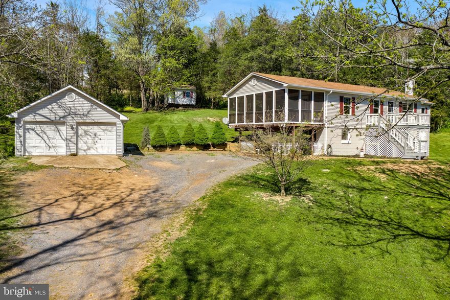 Beautiful Ranch Home on 4.1 Private, Unrestricted Acres in the Country with Creek Frontage! This home has the space you need! You'll enjoy the Large Master Bedroom, Grand Living Room with Gas Fireplace, Spacious Kitchen with Island and Pantry,  Dining Room, Front Deck, Huge Screened in Porch with Hot tub, Fully Finished basement with Bedroom, Additional Room, Full Bath and Family Room and Walks out to Patio.  Detached two car garage, shed and more Deck space to enjoy the outdoors!