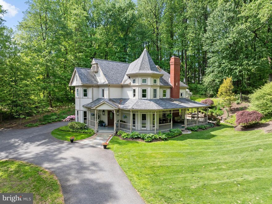 Tucked away on a serene 2-acre lot in the sought-after West Chester Area School District, this authentic reproduction of a turn-of-the-century Victorian captures the warmth and detail of classic architecture while offering all the conveniences of modern living. This beautifully crafted 4-bedroom, 3-bath home offers classic charm and modern functionality—including a recently converted expansive loft above the detached garage with its own full bathroom, adding incredible flexibility to the already generous layout. A wraparound porch sets the tone, framed by flagstone walkways, pristine landscaping, and mature trees that offer beauty and privacy in every season. Inside, you’ll find exquisite original-style woodworking, including an ornate staircase, custom trim, and patterned hardwood flooring. The main level offers inviting living spaces—a cozy sitting room with a propane woodstove, a private study with custom built-ins, and a spacious family room with a wood-burning fireplace. A full bathroom on the first floor adds convenience and versatility.The kitchen is a true centerpiece, featuring abundant cabinetry, a glazed tile backsplash, a large center island with cooktop, and a sun-drenched breakfast nook surrounded by windows.Upstairs, the second floor includes four well-proportioned bedrooms and two full bathrooms, including a primary suite with a custom walk-in closet, spa-like bath with soaking tub and walk-in shower  and a private balcony overlooking the beautifully landscaped backyard and expansive flagstone patio. A partially finished lower level provides even more space and potential, while the detached oversized 3-car garage includes a spacious 1,100+ sq ft apartment above with a private entrance and full bath—ideal for extended family, guests, private extra office space. With energy-efficient geothermal heating and cooling, and thoughtful craftsmanship throughout, this home offers the perfect combination of beauty, comfort, and versatility.If you're seeking space, character, and serenity, 16 Andrien Road is the perfect place to call home