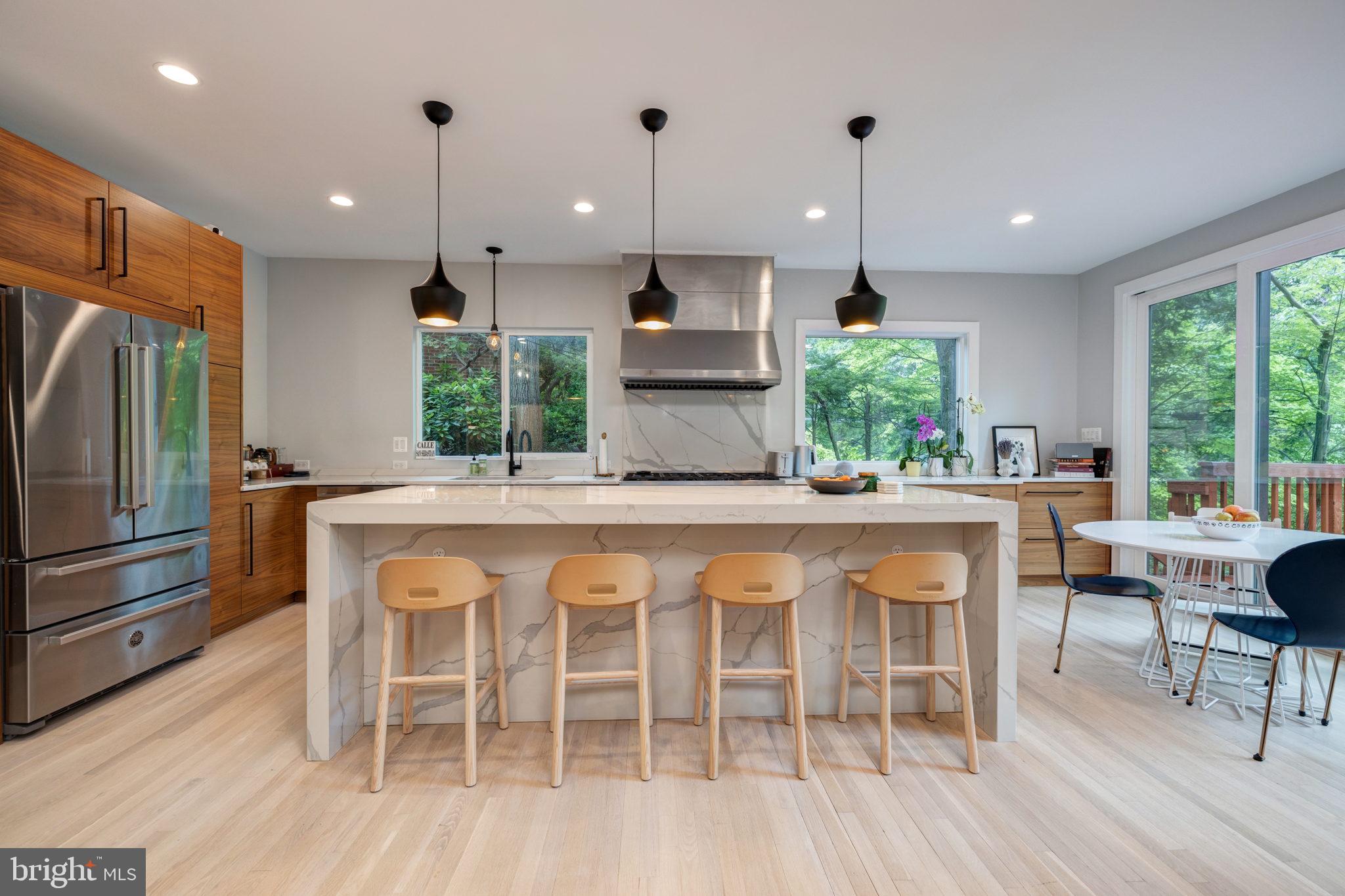 INCREDIBLE PRICE FOR PYLE/WHITMAN SCHOOL DISTRICT! A true Bethesda beauty! 6BR/4BA bath detached home renovated top to bottom - including an entire level added in 2018. Over 3400 sqft of living space, this three level home includes the most spectacular open floor plan and breathtaking views. A chef's dream kitchen with top of the line stainless steel appliances, endless counter and cabinet space, and island perfect for entertaining. A breakfast area allows unobstructed views of the front deck and lush greenery. Open living area leads to formal dining area -- great for hosting guests. A large family room leads to serene backyard oasis. Also on the main level, a bedroom (makes for a great home office!) and a full bathroom. Head up to find four bedrooms and two full bathrooms, including an unforgettable primary suite with 13 foot ceilings and primary bath with spa-like soaking tub and standing shower! The walkout lower level includes a rec room, bedroom, and fully renovated bathroom (renovated in 2022)! Multiple outdoor spaces make for a great flow, including front deck overlooking the front yard. Or head out back to enjoy grilling while soaking in the scenes of the tranquil yard. Top to bottom - this home is a showstopper! Commuting is a breeze with Mass Ave seconds away and easy access to Virginia via 495. Walking distance to Glen Echo Park, enjoy the Carousel, Puppet Theater, Park, Aquarium, and classes such as art, pottery, silver making, and music!
Located on a quiet cul-de-sac, 5223 Wyoming Road has it all!