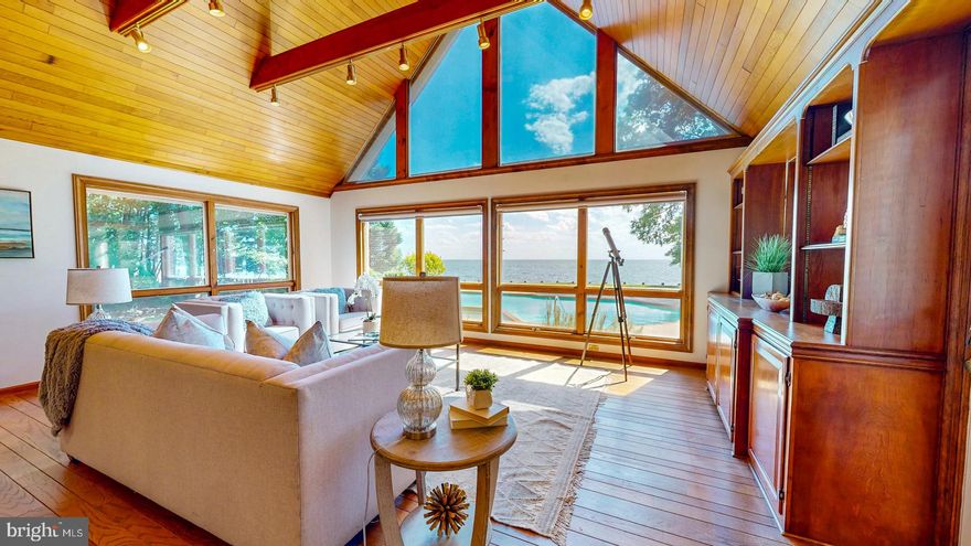 Welcome to this beautiful home sited on 6.52 picturesque acres with truly breathtaking panoramic views of Broad Creek in Royal Oak, Maryland. Stunning sunsets as well! This 4BA, 3.5BA traditional brick home boasts 260 feet of bulkheaded water frontage and outdoor amenities include a large waterside in-ground pool with hot tub,  a poolside gazebo, and private dock with a lift.  Inside, the traditional floor plan offers a fabulous great room with floor to ceiling windows which gives the incredible feeling of being on a ship. Adjacent is the light-filled eat-in kitchen with center island, updated appliances, and amazing water views. The formal dining room is accessible from the kitchen and has a wood burning fireplace. On the main level is a primary suite with gorgeous water views and a new ensuite bath, and there are 2 additional guest bedrooms which share a hall bath. The second level features a second large primary bedroom with an expansive ensuite bath overlooking the water, and includes a soaking tub , double vanities, and an enclosed walk-in shower. There is also a second-story office that overlooks the great room and a spacious bonus room which accesses the large walk-in attic offering ample storage space. The 2-car attached garage comes with a workshop area, and there is a 2-bay detached garage/shed (sold as-is). For those who love gardening, there is a small greenhouse abutting the house as well. This exceptional home perfectly blends convenience, comfort, and natural beauty. Don’t miss the opportunity to own this unique waterfront property.