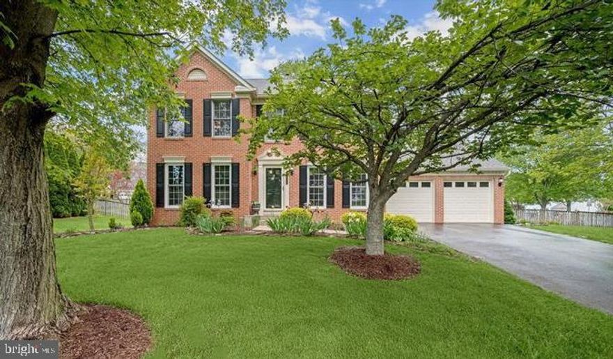 Welcome to 8258 Elko Drive, a fabulous colonial nestled on a corner lot in the sought-after Montgomery Meadows community of Ellicott City. This beautifully maintained home features hardwood floors, classic moldings, sun-drenched interiors, and a soothing neutral color palette. The welcoming foyer is flanked by formal living and dining rooms ideal for entertaining and everyday living. The eat-in kitchen is a true centerpiece, offering cathedral ceilings, sleek stainless steel appliances, a pantry, granite countertops, display cabinetry, and a breakfast bar that flows into the breakfast room. Just off the kitchen, the cozy family room is anchored by a warm fireplace, creating the perfect gathering space. A convenient powder room and access to the attached two-car garage complete the main level. Upstairs, the spacious primary bedroom offers a peaceful retreat with a walk-in closet and a luxurious en-suite bath featuring dual vanities, a soaking tub, and a glass-enclosed shower. Two additional bedrooms and a full bath complete the upper level. The finished lower level adds valuable living space with a large recreation room, a full bath, a laundry room, and an expansive storage area.  Very easy to convert to a 4th bedroom with sitting room or convert large storage area into more finished living space. Outside, enjoy the privacy of a fenced backyard with a patio—ideal for relaxing or entertaining—along with the convenience of a corner lot and an attached garage. With its blend of comfort, space, and style, this home offers everything you need in one of Ellicott City's most desirable communities.