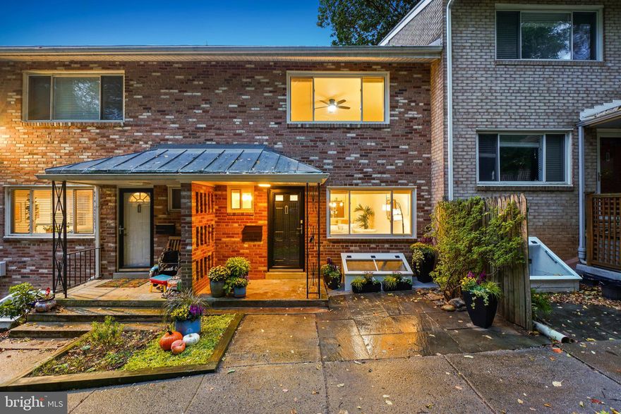 Welcome! To this completely renovated, sun-drenched townhouse-style condominium located just steps from Sligo Creek Park, pleasant dining and cafe options, and transit. The bright living room features wood flooring and a large picture window and opens to the dining area with a modern chandelier and an expansive window. The brand-new granite kitchen includes Kraftmaid Shaker cabinets, a stainless-steel appliance suite, a pantry cabinet, tile flooring, and access to the rear common area. The main level also offers a remodeled powder room and a coat closet.
Upstairs, there are two bedrooms, a renovated full bathroom, and two linen closets. Both bedrooms feature wood flooring, ceiling fans, and two closets. The primary bedroom is spacious with a large window.
The lower level offers versatile living space with new luxury vinyl flooring and updated overhead lighting. This versatile area can function as a bedroom, family room with workspace or a guest room and includes laundry facilities.
Outside, there is a covered front porch and access to the rear common grounds. Located on a quiet street with a dedicated off-street parking space, this home is less than a block from Sligo Creek Parkway and Long Branch Trail, offering miles of hiking and biking paths. Sligo Creek Parkway closes to cars on weekends, enhancing the walking experience. Sligo Creek Park, a free-flowing tributary of the Anacostia River, offers a peaceful retreat surrounded by woodlands, trails, and abundant wildlife—perfect for those seeking fresh air, scenic beauty, and a connection to nature, all just minutes from Downtown Silver Spring with easy access to I-495.