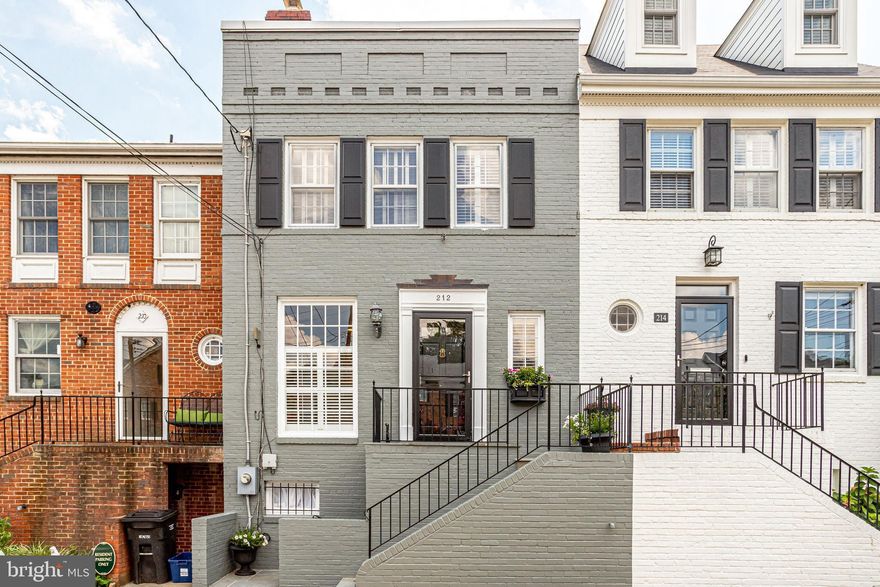 This fabulously renovated Yates Gardens townhouse offers an open main level living area with gorgeous kitchen, island seating, abundant storage including a custom pantry, wood burning fireplace, large windows allowing generous natural light and a main level half bath. The spacious lower level includes a family room, additional wood burning fireplace, built-in bookcases, separate laundry, chic renovated full bath and access to the private and serene bricked back patio and garden. A wonderful layout on the upper level with 3 bedrooms and hallway skylight contributing to additional sunlight. Off-street parking for 1 car and easy street parking for additional vehicles.  HVAC, hot water heater and furnace replaced in 2018 and added an air filtration system (Air Scrubber Plus with ActivePure technology removes up to 99.9% of the harmful contaminants in your home). Just steps to the Potomac River, Jones Point Park, Windmill Hill Park, Lyles Crouch Elementary and a few blocks to the shops and restaurants on King Street. Easy access to King Street Metro, National Airport, DC, Amazon HQ2 and major commuter routes.
