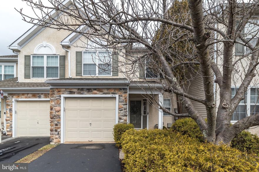 Welcome to this charming move -in ready 3 Bedroom townhome with  partial stone front exterior and manicured landscaping that lead to the covered front entry .  The  inviting  foyer with crown molding and bamboo flooring, creates an exceptional first impression—one that carries throughout the first floor. A well-placed powder room is an added convenience. Step into the sun-drenched and spacious living room, an ideal setting for both lively gatherings and quiet moments of relaxation. The bamboo floors, crown molding, and matching window trims add a cohesive elegance, while a stylish pass-through window connects the space seamlessly to the kitchen. Designed with both beauty and functionality in mind, the modern eat-in kitchen is a chef’s dream, featuring gleaming granite countertops, 18" ceramic tile flooring, classic wood cabinetry, an oversized pantry closet, and sleek stainless steel appliances. Whether you're preparing a casual breakfast or a gourmet feast, this kitchen is up to the task. Enjoy meals indoors, or on sunny days, step through the kitchen’s sliding glass doors to dine alfresco on your custom flagstone  patio. This space is newly created and has fresh landscaping around the perimeter, perfect for warm-weather entertaining.  Upstairs, three generously sized bedrooms provide comfortable accommodations. The primary suite is a true retreat, boasting a vaulted ceiling, large  windows that flood the space with natural light, plush carpeting, a walk-in closet and en-suite bathroom  with soaking tub. The additional bedrooms are equally inviting, each offering ample space and natural light.  One—currently used as a home office—features oak hardwood  flooring that extends into the hallway. These two bedrooms share a well-appointed hall bathroom.  Completing the second floor is a dedicated laundry room.  The location of this home is super convenient, just a short walk to Warwick Community Park and close to Rt. 263 and major highways. It's within the Central Bucks School District and near various amenities and restaurants in Doylestown. With thoughtful details, modern finishes, and a layout that balances comfort with style, 1471 Sweetbriar Drive is ready to welcome you home!
