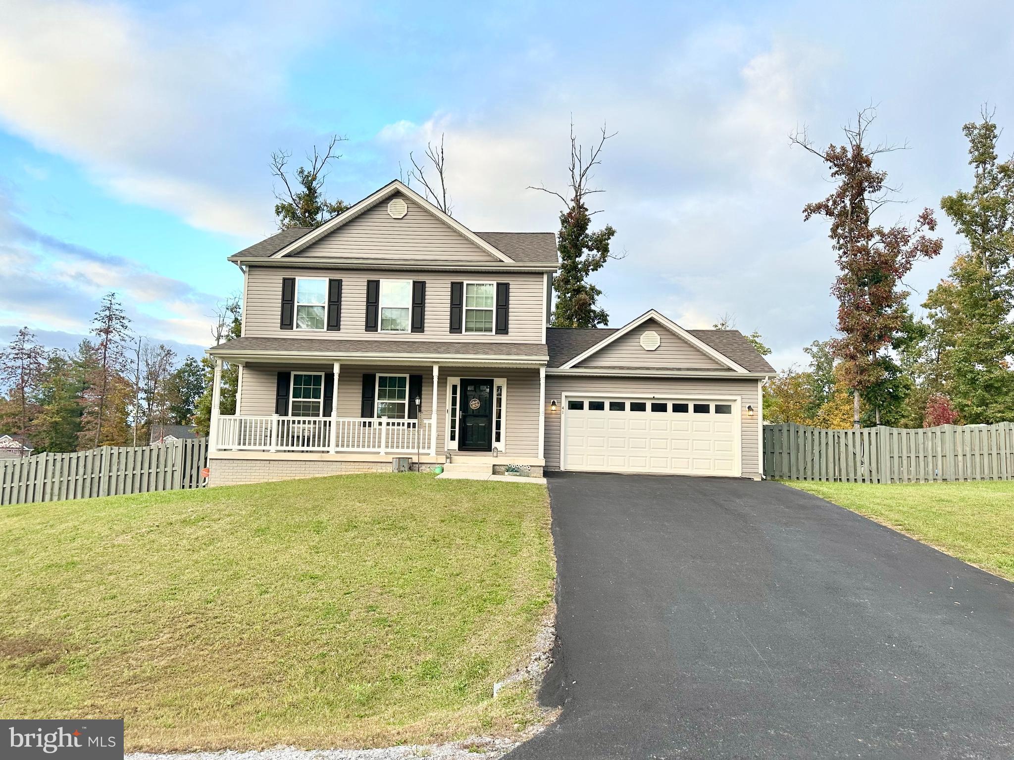 Lovely 3 bedroom 2.5 bathroom home located in a small community tucked away in Hedgesville. Boasting a partially open floor concept with a granite kitchen, large granite island, 42 inch cabinets, oversized shelving in the pantry, a fireplace, and laminate hardwood floors throughout the main level, downstairs is just the start of this magnificent home. Upstairs you will find your primary bedroom with a tray ceiling and a tiled primary bathroom with a separate tiled shower and soaking tub. Your tiled laundry room is situated upstairs as well along with 2 other secondary bedrooms with large closets, and another tiled bathroom. Under this home is a fully unfinished walk-out basement with rough in plumbing waiting for you to utilize its potential. This home is already equipped with dual HVAC units to provide sufficient heating and cooling to any additional finishes. Make your appointment today!