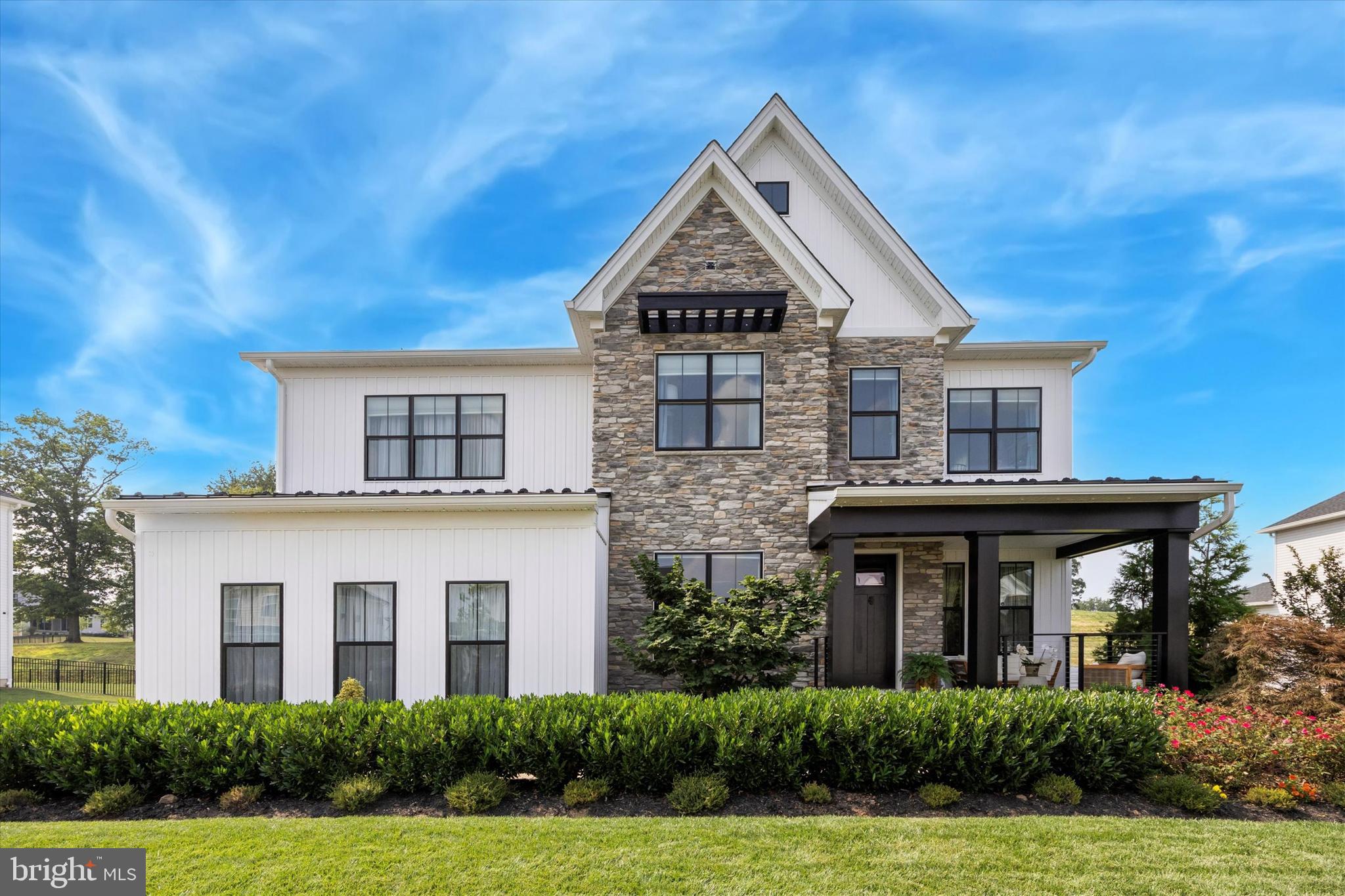 "WOW!", is a phrase you will find yourself uttering many times as you get acquainted with this exquisite Rowling Modern Farmhouse home in Worcester's Reserve at Center Square community. At just three years young and with over $300,000 in luxury upgrades completed in the past year and a half (this is IN ADDITION to many builder upgrades), it won't take long for you to fall in love with this impressive 6 bed, 5.5 bath home in Methacton SD! Your love affair will begin before you even enter as you admire the gorgeously appointed hardscaping and landscaping, which give interest and natural beauty the whole year through to complement the tasteful stone and board and batten exterior. You may even be tempted to linger on the spacious and newly railed front patio, where you'll imagine yourself spending hours relaxing in the shade and enjoying a cool breeze on a warm day. Upon entering, you will love the sun soaked, airy feel. Imagine yourself hosting dinner parties in the formal dining space, and socializing around the oversized gourmet kitchen island that overlooks the living areas. Here, you can cozy up by the fireplace and look out over the green yard through the large picture window. The first floor also includes a convenient bedroom with en-suite full bath, perfect for guests, in laws or as an au pair suite. Rounding out the first floor is a versatile additional den/office space, a spacious pantry, and a lovely half bath. Also accessed from this floor is the three car garage, newly decked out with paint, resurfaced epoxy floor, cabinetry and insulated doors - perfect for keeping organized and working on projects. Your vehicles will be as comfortable as you are! Upstairs, you will find an open living area off to the left, and a pair of well-sized bedrooms connected by a jack-and-jill bathroom off to the right. Down the hall, you will find another bedroom with its own princess suite bathroom, a laundry room, and the owner's suite, complete with an electric fireplace, bathroom with dual vanity, an oversized tiled shower and a generously sized walk-in closet. As if that weren't enough, wait until you see the finished basement! Accessed via a door disguised as a bookcase, like your very own speakeasy, this newly renovated space will stun your guests! Here, you'll find a well-equipped space for parties with a tastefully designed wet bar featuring beverage refrigerator, icemaker, sink, and dishwasher. This finished basement also features an electric 6 ft fireplace with 220V heating capacity and a hearth, soundproofing, and an attractive statement accent wall. Your guests may even stay overnight comfortably with a bonus bedroom and full bath there as well! Two storage areas and a basement washer and dryer make this area self-sufficient! Rouding out this gorgeous property - the outdoor space - backed by a privacy berm, this serene private yard includes a beautiful covered patio with custom remote controlled screen enclosure, lighting, and a natural gas fireplace (very cozy in winter!), brand new pavers and a beautiful pavilion, complete with a sink and water, beverage refrigerator, natural gas rotisserie grill, and wet bar. Remote controlled screens here provide a wind or sun block if needed! Also of note is the yard sprinkler system, large custom shed, central air purifier/humidifier, and other details too numerous to mention! The property features a hot tub to enjoy the backyard even in the cooler months. No detail has been overlooked in your new home. Enjoy the wonderful location in Worcester, known for its open space, proximity to Heebner Park and the Zacharias Creek trail, Skippack Village, Blue Bell, and more! One Year American Home Shield home warranty included! Come fall in love with it today!