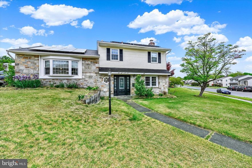 Classic stone exterior. Art-glass entry. A jaw-dropping reclaimed wood accent wall. This and so  much more found in this one-of-a-kind Wynnewood split-level. Step into a living space that commands attention: the spacious family room features and exposed brick accent wall and arched fireplace niche, which create a warmth and character rarely found at this price point. LVP flooring flows throughout, complemented by custom woodwork accents. Three bedrooms and 1.5 updated baths offer comfortable, move-in ready living, while the kitchen features stainless steel appliances and ample cabinetry. Out back, a large deck overlooks a spacious yard with a storage shed, perfect for entertaining. Optional community pool membership available. Quick access to I-695, I-95, and I-895 makes this well-established Wynnewood address as convenient as it is charming.