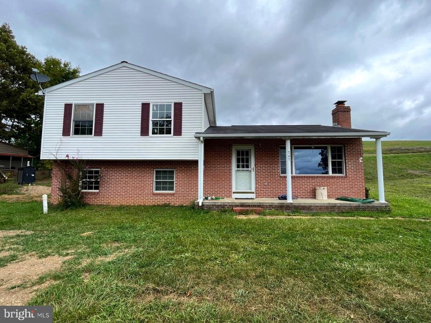 Bring your handyman and run to the mountains! With a little elbow grease and sweat equity, you could turn this split-level home into your own West Virginia dream. Perched high in the mountains, this retreat offers peace and tranquility.  A newly completed survey has every corner of this 6.61-acre paradise mapped out just for you. A new outdoor wood stove will keep you warm all winter, and with an oversized metal garage, you will have plenty of space to store all of your toys!  The potential is here, just waiting for you to make it your own.  This home features 3 bedrooms and 1 full bathroom on the main level with an additional bathroom in the basement. The living room offers a fireplace that is warm and inviting for those cold winter nights. This property is situated perfectly on a lot with beautiful views and privacy! Don't miss your chance at this great property!