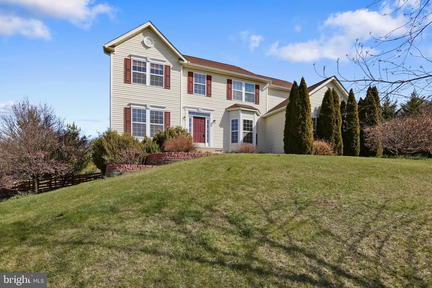 Beautiful Colonial in Spruce Hill Subdivision. The main level features an open layout with two story entryway, Formal Living and Dining Room, Large Gourmet Kitchen with granite counter tops, island, breakfast bar, double wall oven, gas cooktop, pantry, and adjoining sunroom addition. The two story Family Room off the Kitchen has a gorgeous stone gas fireplace. Private Home Office, and half bath. Upper level has 4 Bedrooms and 3 Full Baths including the Primary Owner's Suite with large sitting room, walk in closet, and attached luxury bath. Two Junior Bedrooms share a full bath in a jack-n-jill layout. The Fourth Bedroom is a Princess Suite with attached private bath. Lower level is unfinished and ready to be finished to add even more living space. Exterior Features include the large fenced in rear yard with a space perfect for entertaining including the expansive deck and patio with built in fireplace! 2 car side load garage and paved drive offer plenty of parking. Located just off 340 perfect for commuting and across from Washington High School as well as minutes to downtown Charles Town with plenty of shopping and dining options.